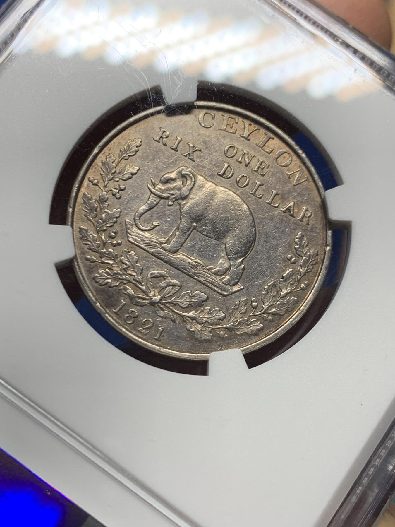 《竞宝斋》第455场 周日，周一 2场连拍 （全场包邮，欢迎送拍） NGC AUD 英属锡兰（斯里兰卡） 1821年 1立克斯 银币 正面为乔治四世肖像 细节很好 少见品种