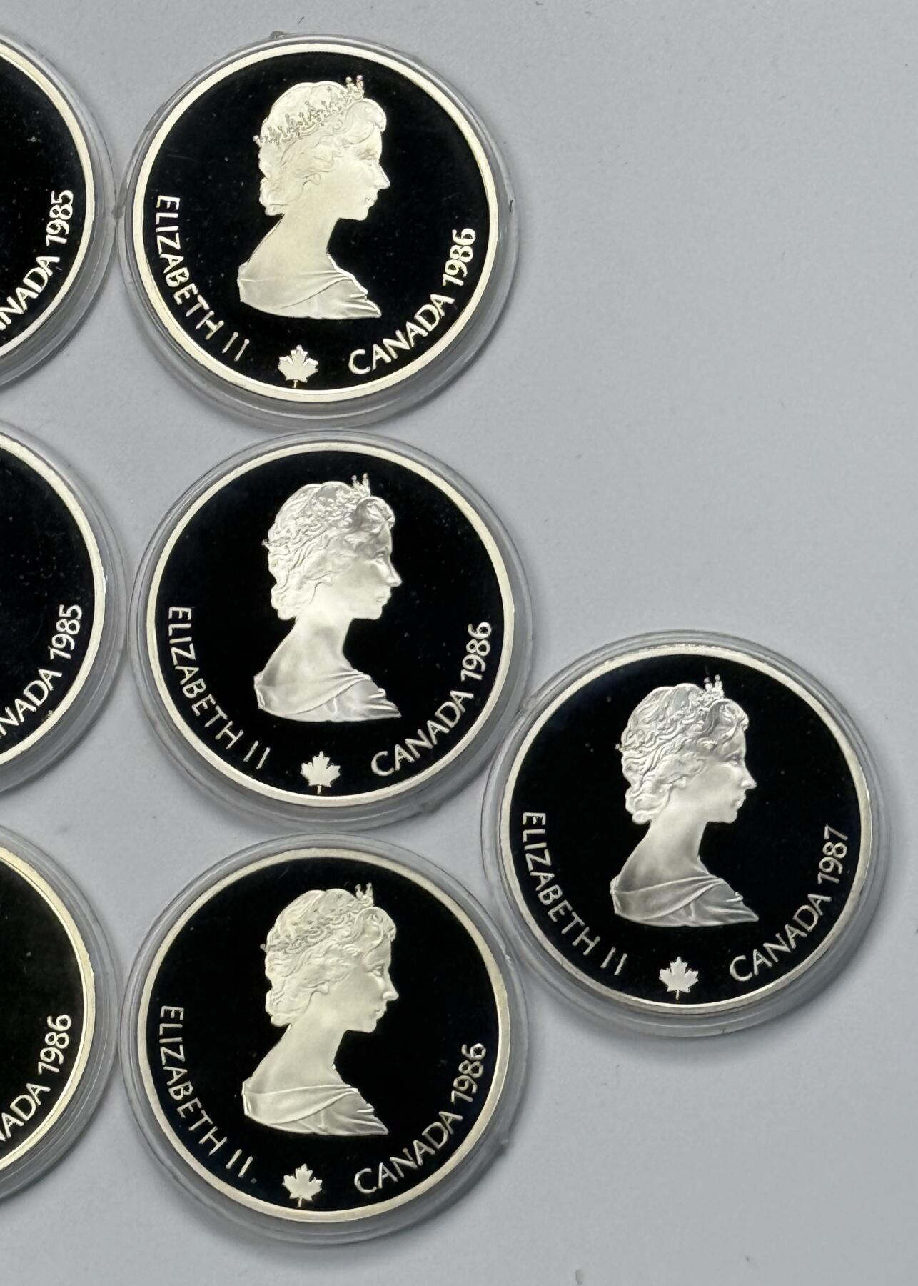 S&S Numismatic世界钱币-拍卖 第118期  加拿大1985-1987年 卡尔加里冬奥会 20加元精制纪念银币10枚全套 34.07克925银/枚，品相如图，塑料外壳有磨损