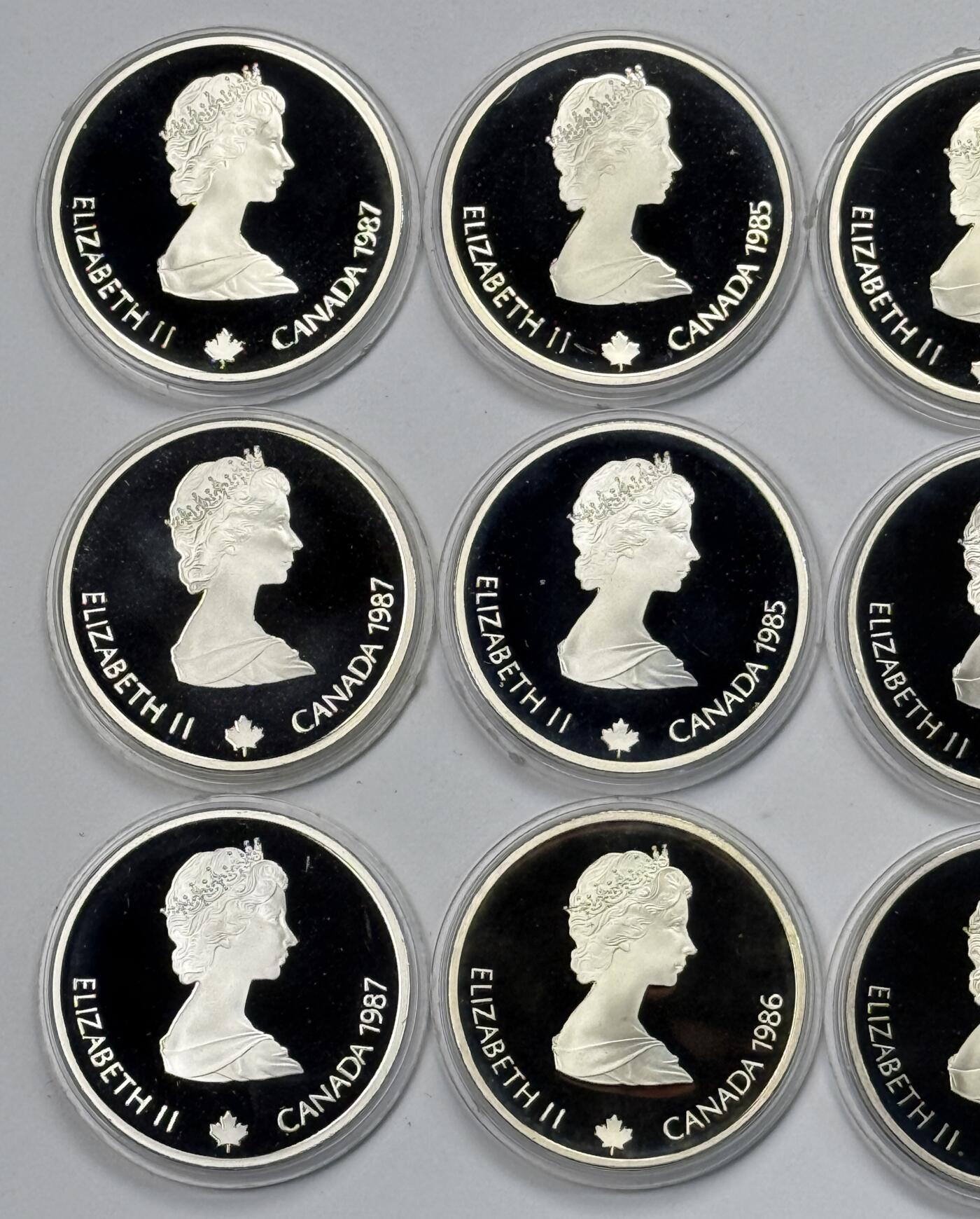 S&S Numismatic世界钱币-拍卖 第118期  加拿大1985-1987年 卡尔加里冬奥会 20加元精制纪念银币10枚全套 34.07克925银/枚，品相如图，塑料外壳有磨损