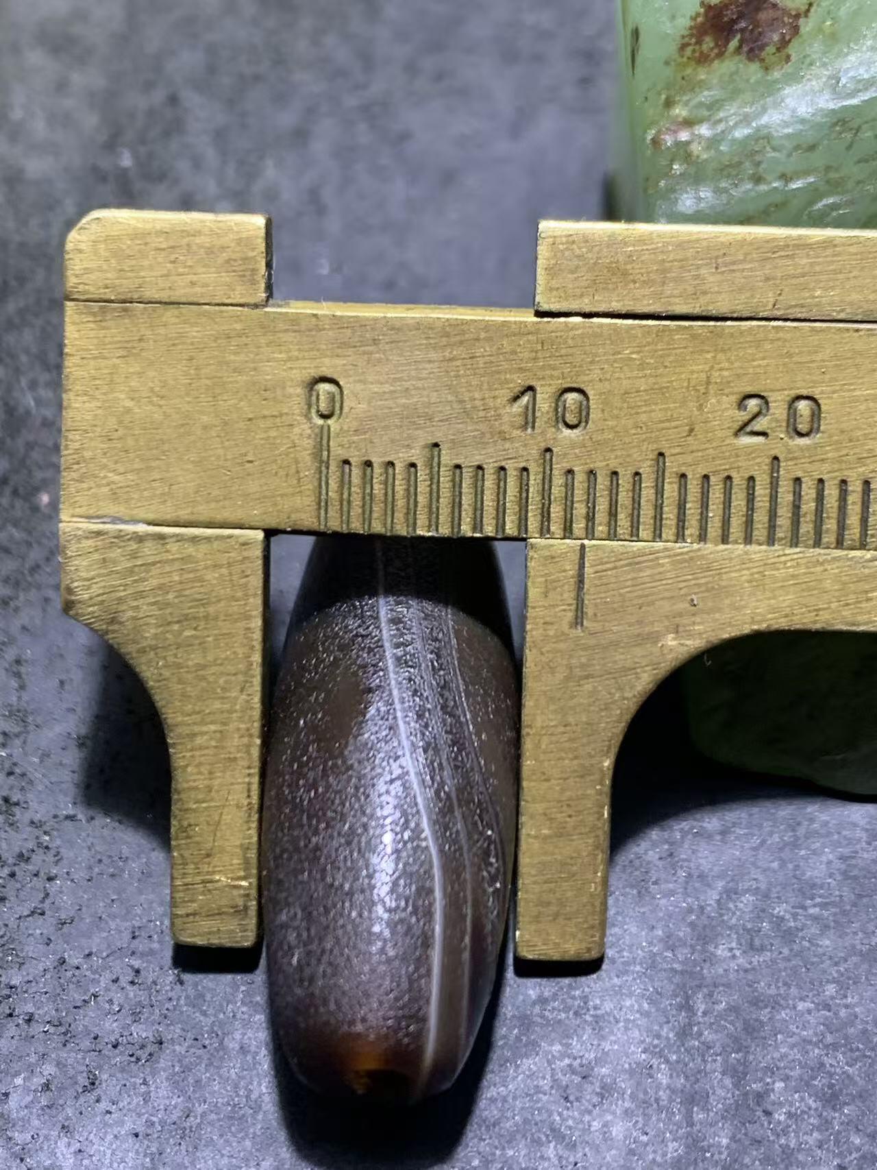 药师玛瑙风化纹随形桶珠一个