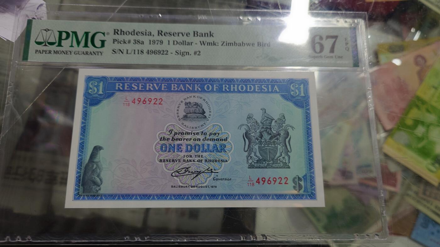 【新年五拍】世界钱币～微拍第226期暨2026年第5期   1979年罗德西亚1元 PMG67E全新绝品尾号922