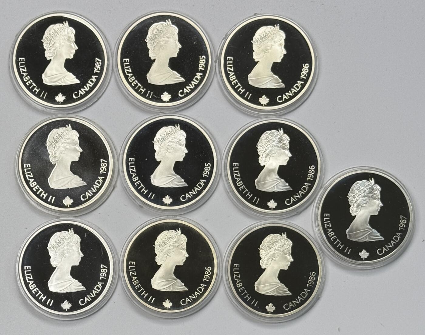 S&S Numismatic世界钱币-拍卖 第118期  加拿大1985-1987年 卡尔加里冬奥会 20加元精制纪念银币10枚全套 34.07克925银/枚，品相如图，塑料外壳有磨损