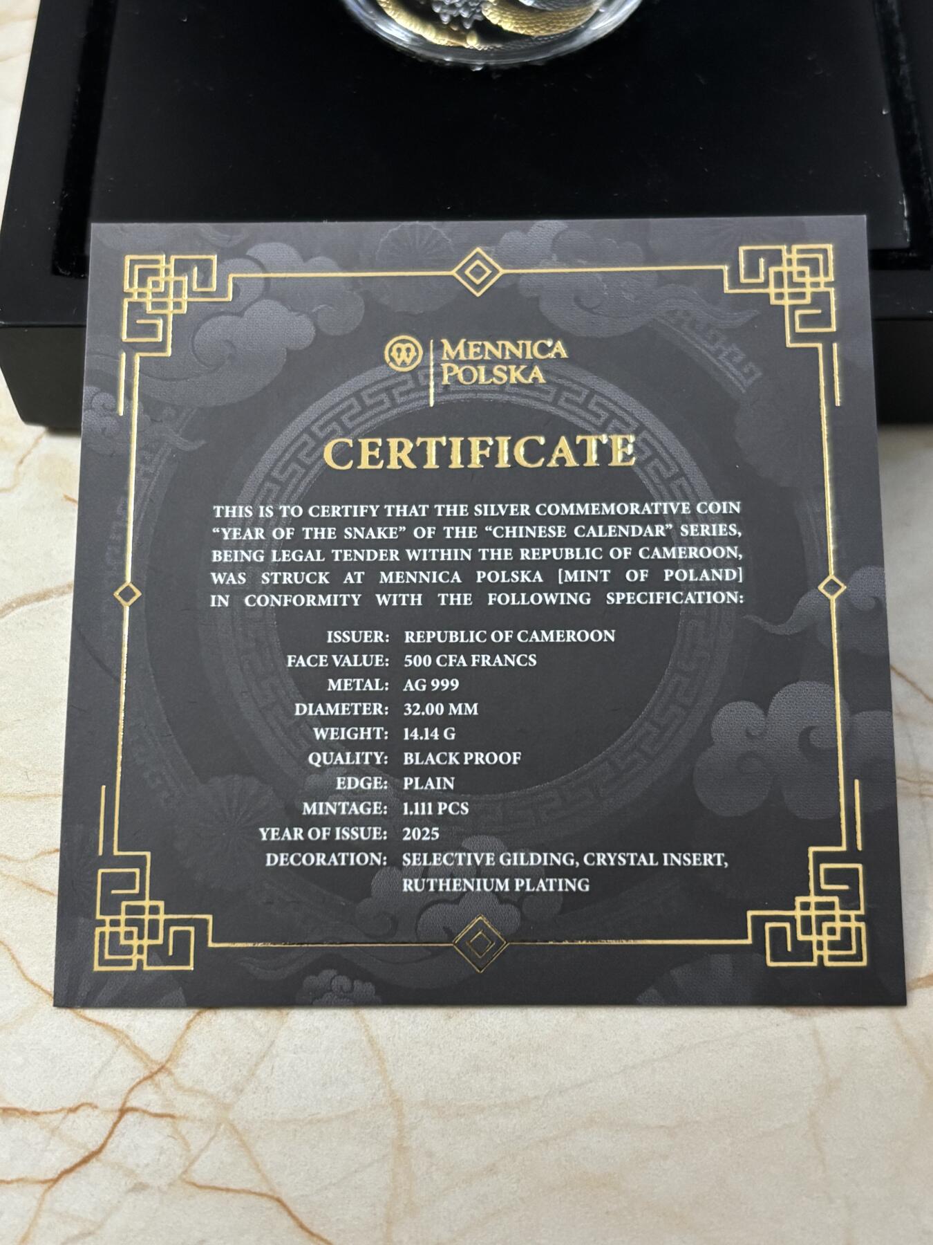 第187期拍卖 喀麦隆2025年中国生肖系列蛇年镶嵌水晶钌化银币，999银镀金钌化，14.14克，发行1111枚，