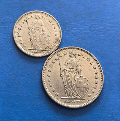 外国优质银币非洲美洲币，周六九点倒数截拍，满百包邮，持续收拍 - 瑞士1971 年 0.5/1 法郎币2枚，正面展持盾女神像（“HELVETIA” 标识），背面饰月桂环 + 币值，金属币承载瑞士经典货币设计，兼具国家符号与传统纹饰收藏价值。