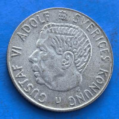 外国优质银币非洲美洲币，周六九点倒数截拍，满百包邮，持续收拍 - 瑞典 1967 年古斯塔夫六世 1 克朗银币，币面含瑞典国徽与国王头像，承载瑞典王室及国家符号，流通包浆独特，兼具北欧货币史价值与王室钱币收藏属性。