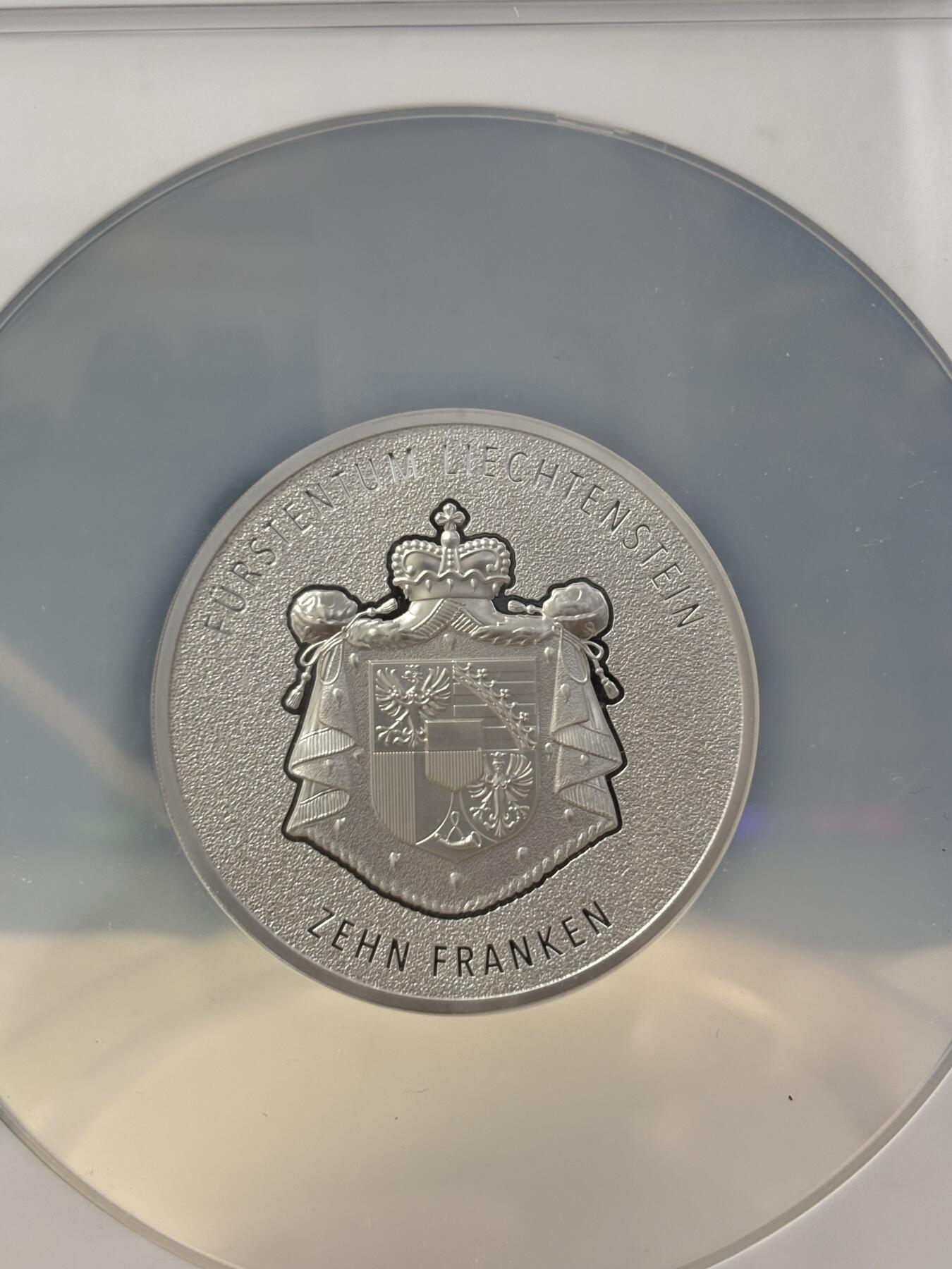 第187期拍卖 列支敦士登2024年瑞士法郎诞生100周年莱茵河谷2盎司银币NGC-MS70首，9999银，发行1000枚