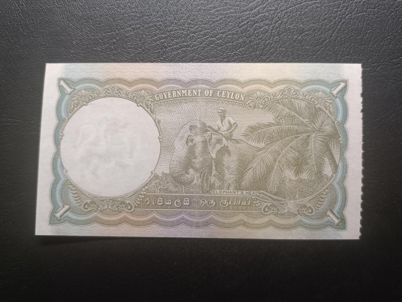 2026一月第二期，总212期 英属锡兰（现斯里兰卡）1948年1卢比AUNC，乔治六世国王和骑大象，少见英属殖民地品种，特色是一侧有类似门票的齿孔