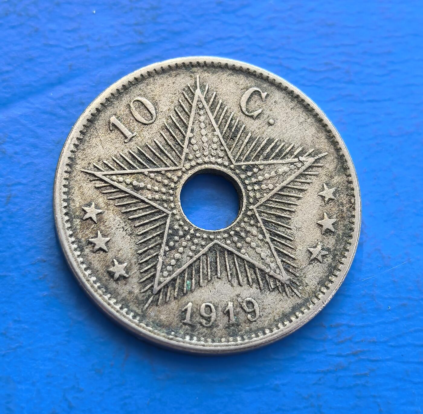 外国优质银币非洲美洲币，周六九点倒数截拍，满百包邮，持续收拍 比属刚果1919年10 分硬币，带圆孔设计，正面标 “BELGISCH-CONGO”，背面饰五角星，属比利时殖民时期刚果货币，风格具殖民货币特征，是非洲殖民币收藏品类。