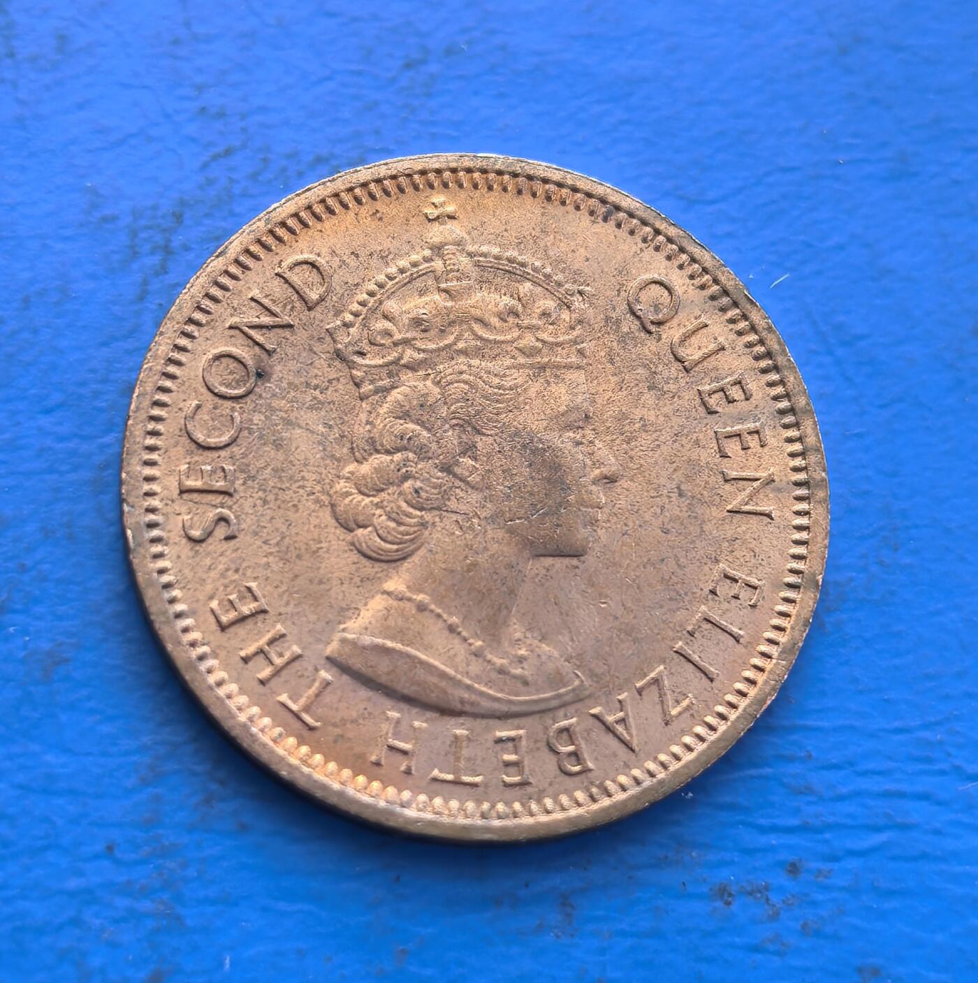 外国优质银币非洲美洲币，周六九点倒数截拍，满百包邮，持续收拍 毛里求斯1966 年 2 分币，正面印伊丽莎白二世头像，背面标国名与币值，铜质币承载英联邦时期毛里求斯货币文化，兼具殖民时代纪念与地域收藏特色。