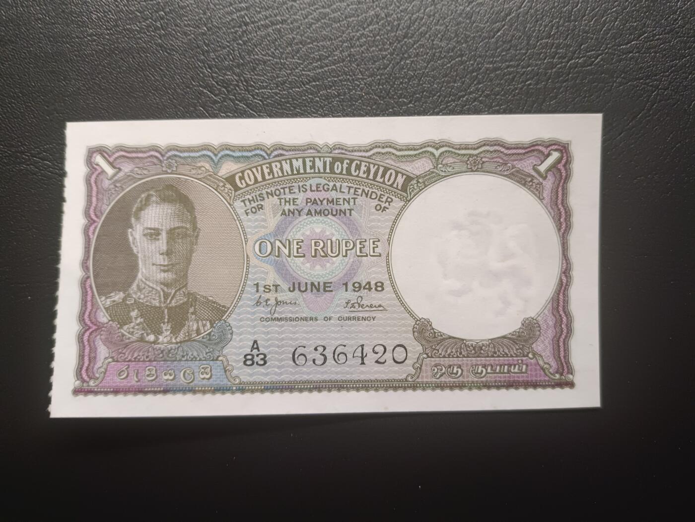 2026一月第二期，总212期 英属锡兰（现斯里兰卡）1948年1卢比AUNC，乔治六世国王和骑大象，少见英属殖民地品种，特色是一侧有类似门票的齿孔