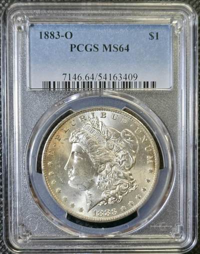 “甄选寰宇 · 臻藏岁华”新年精品场（直播拍卖）-甄臻铺-世界币章拍卖（第47期）送拍享返佣金等优惠多多 - PCGS-MS64 美国1883年O版摩根一元银币，双面带些黄油彩