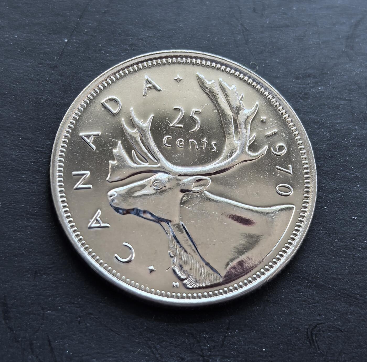 外国优质银币非洲美洲币，周六九点倒数截拍，满百包邮，持续收拍 加拿大 1970 年25 分精制币，正面是伊丽莎白二世像，背面绘驯鹿头像（加拿大标志性动物），币面工艺细腻，题材具本土特色，兼具流通纪念与收藏价值。