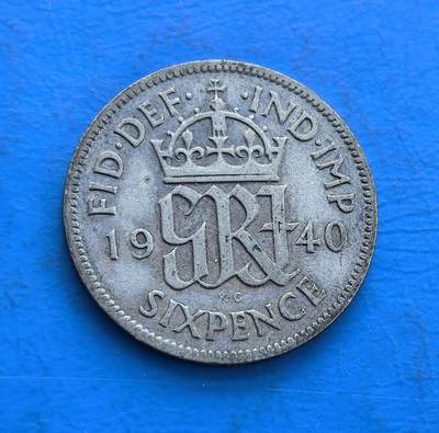 外国优质银币非洲美洲币，周六九点倒数截拍，满百包邮，持续收拍 - 英国 1940 年 6 便士银币，正面皇冠配 “GR” 花押、“FID DEF IND IMP” 铭文，背面是乔治六世头像，战时年份 + 君主题材，银质币兼具历史与材质收藏价值。