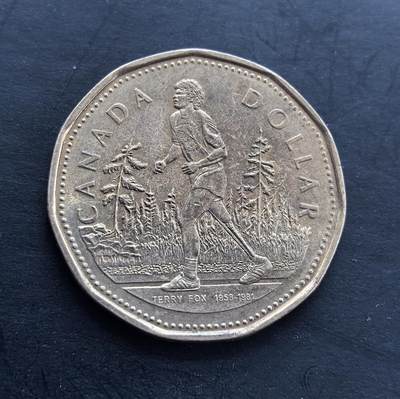 外国优质银币非洲美洲币，周六九点倒数截拍，满百包邮，持续收拍 - 加拿大 2005 年特里・福克斯 1 元纪念币，正面绘抗癌义跑者福克斯的形象，背面是伊丽莎白二世像，纪念其抗癌精神，题材具人文意义，是加拿大经典纪念流通币。