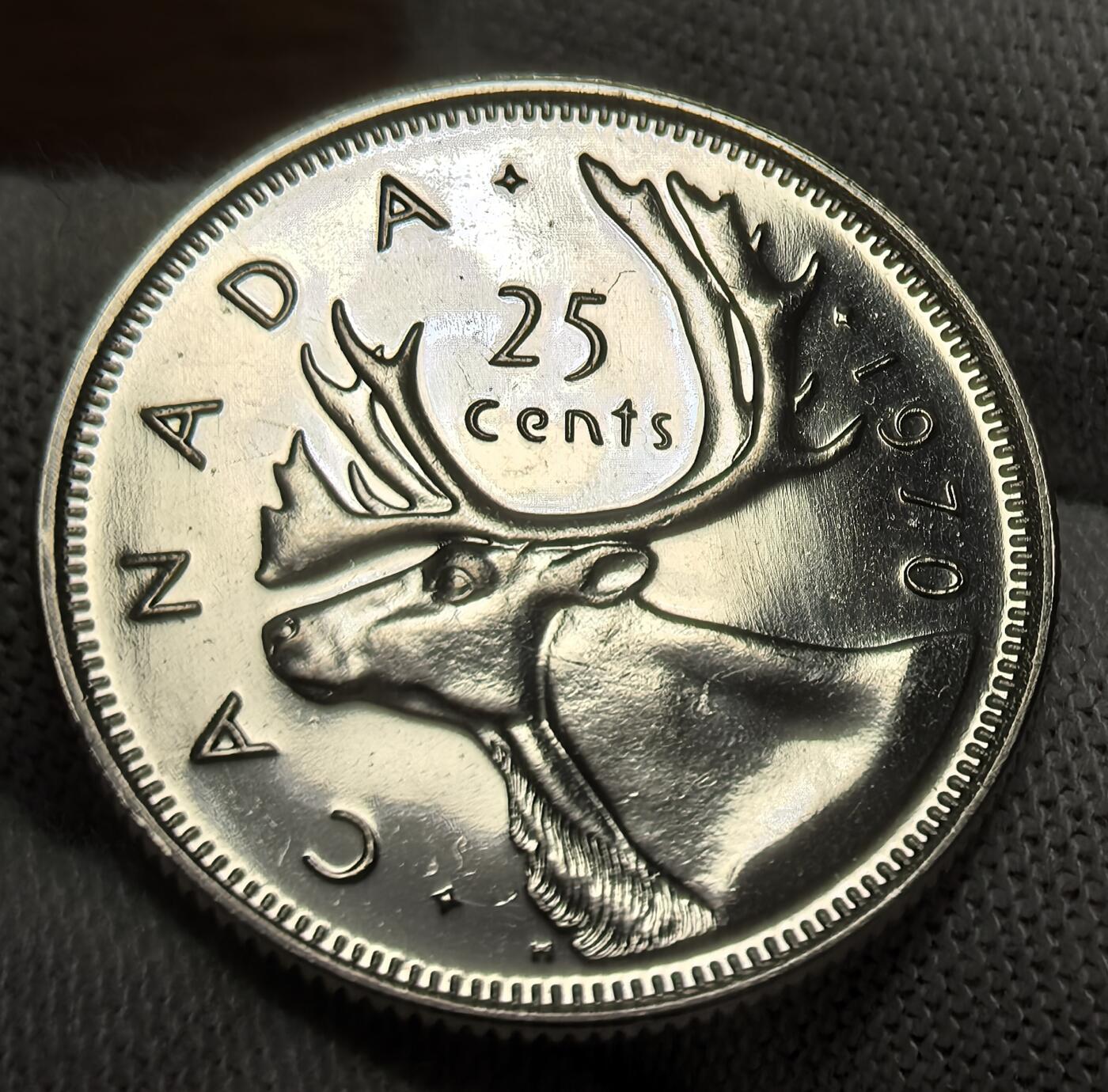 外国优质银币非洲美洲币，周六九点倒数截拍，满百包邮，持续收拍 加拿大 1970 年25 分精制币，正面是伊丽莎白二世像，背面绘驯鹿头像（加拿大标志性动物），币面工艺细腻，题材具本土特色，兼具流通纪念与收藏价值。