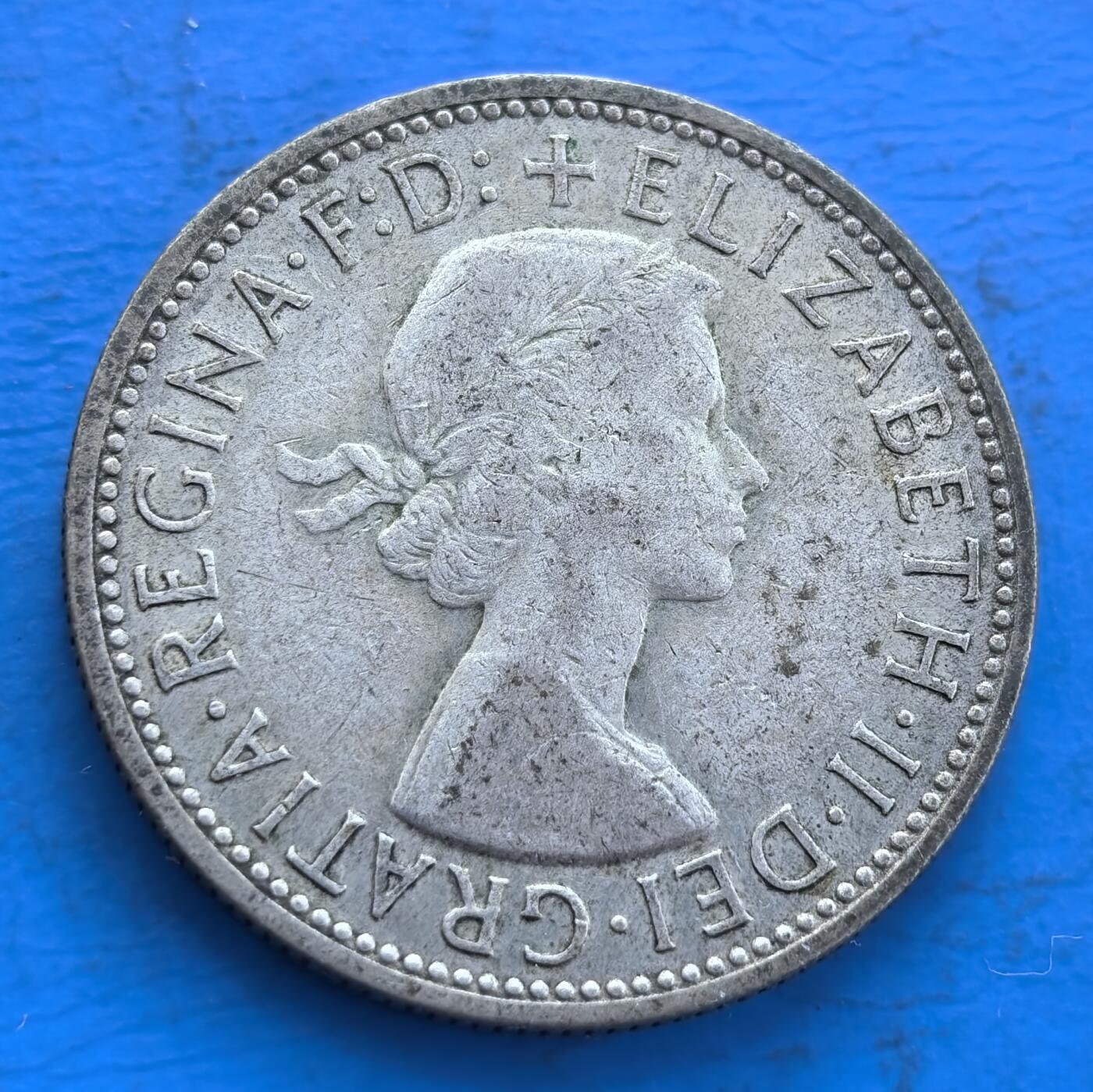 外国优质银币非洲美洲币，周六九点倒数截拍，满百包邮，持续收拍 澳大利亚1960 年弗洛林银币11克纯银价102元，币面饰袋鼠、鸸鹋与国徽，关联英联邦时期澳洲货币史，流通包浆独特，兼具地域文化标识与钱币收藏价值。