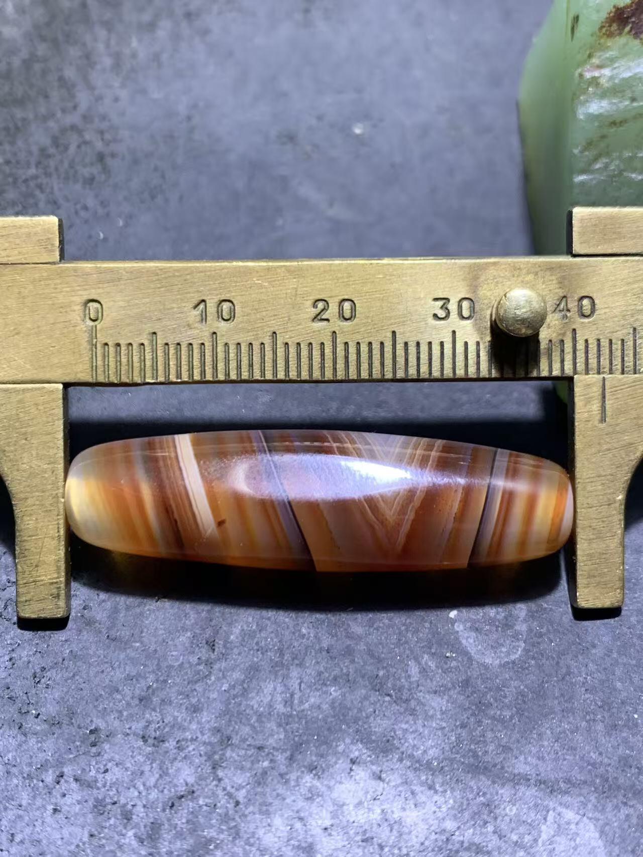 高玉化千层纹巴西玛瑙随形通货桶珠一个，，