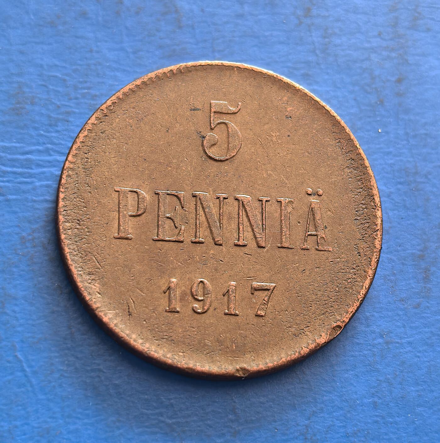 外国优质银币非洲美洲币，周六九点倒数截拍，满百包邮，持续收拍 俄占芬兰流亡政府1917 年 5 芬尼铜币，正面标币值与 “PENNIA”，背面展沙俄双头鹰国徽（芬兰独立前标识），承载一战末期芬兰货币文化，兼具地域历史与殖民符号收藏价值。