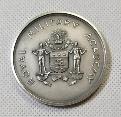 “甄选寰宇 · 臻藏岁华”新年精品场（直播拍卖）-甄臻铺-世界币章拍卖（第47期）送拍享返佣金等优惠多多 - 1923年英国皇家军事学院Benson杯水上运动奖章，银质，直径45.3毫米，重44.7克。正面刻有学院徽章和“ROYAL MILITARY ACADEMY”字样，背面刻有“1923 AQUATIC SPORTS Benson Cup L.T.G. Ricketts”字样，奖杯名称及获奖者姓名清晰可见。整体保存完好，包浆自然，细节清晰，照片所示边缘是原铸时的拉模痕迹不是磕碰，细节见图