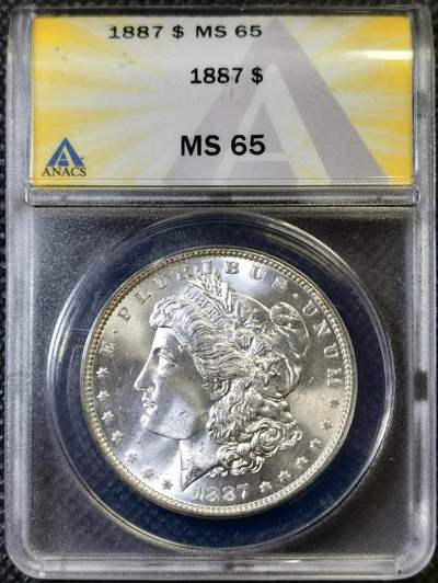 “甄选寰宇 · 臻藏岁华”新年精品场（直播拍卖）-甄臻铺-世界币章拍卖（第47期）送拍享返佣金等优惠多多 - ANACS-MS65 1887年美国摩根银币，老盒子，品质很不错