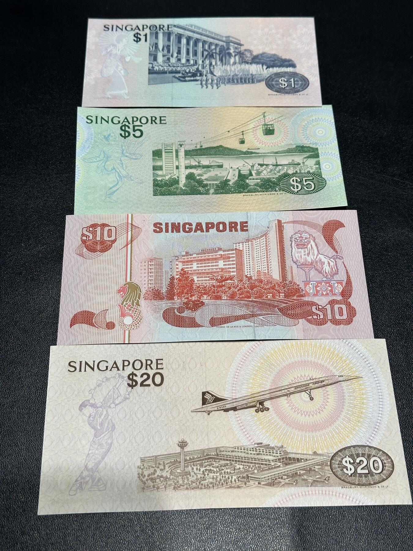 《外钞收藏家》第六百零一期（畅拍场）（本平台长期征集拍品、欢迎藏友们联系合作） 新加坡鸟版1/5/10/20元4张小套（UNC品相的不多见了） 全新轻微潮