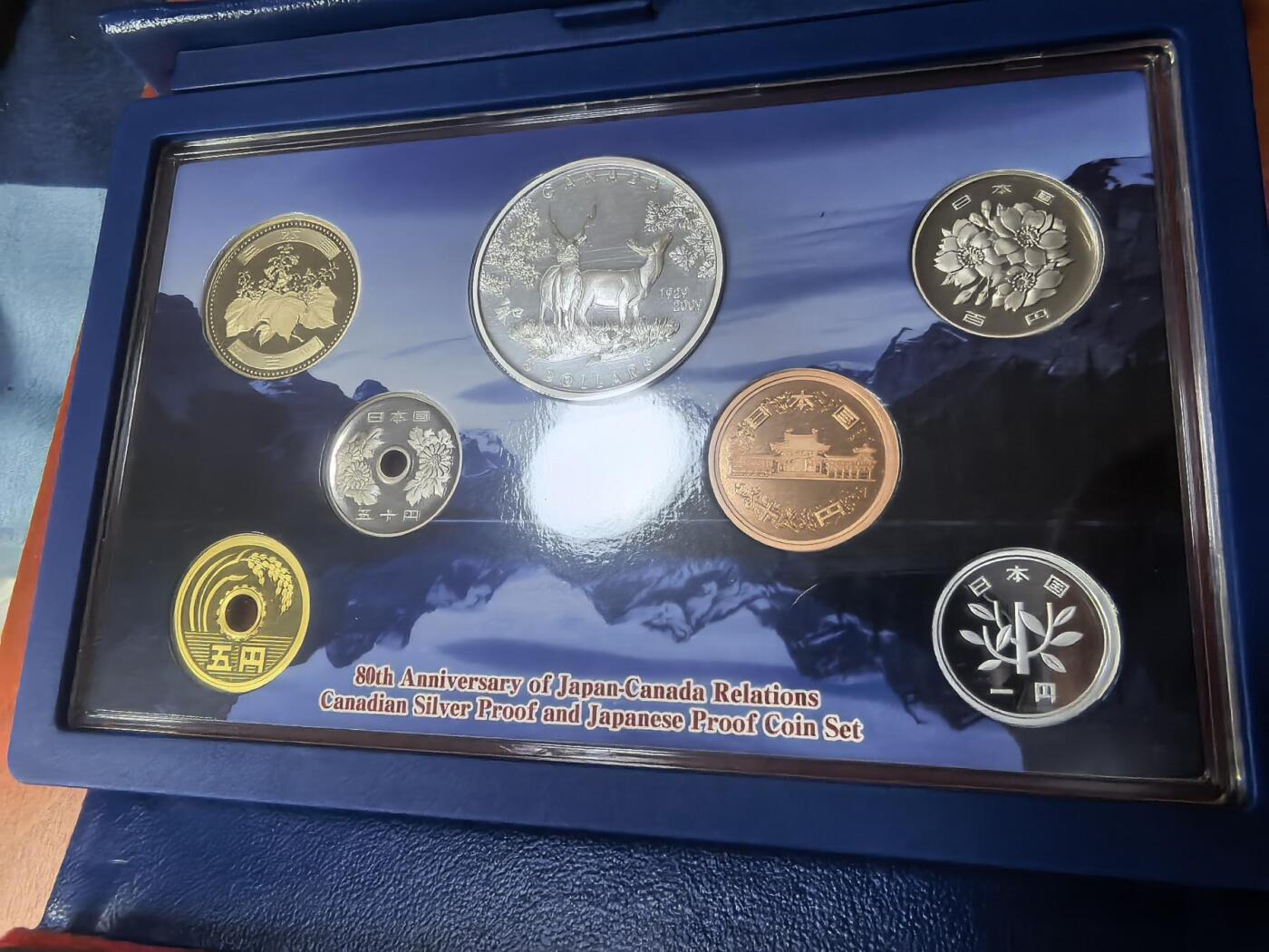 长老汇蛇年精选第九十三场拍卖 2009日本和加拿大友好80周年7枚精装套币，盒证全，含5加元同主题精制银币1枚，25.175克925银，克书标注1盎司999银