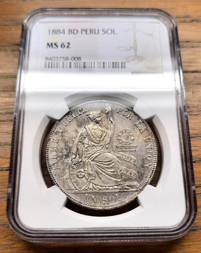 凡希社世界钱币微拍第三百十八期 - 1884秘鲁座人SOL大银NGC-MS62，原味五彩。