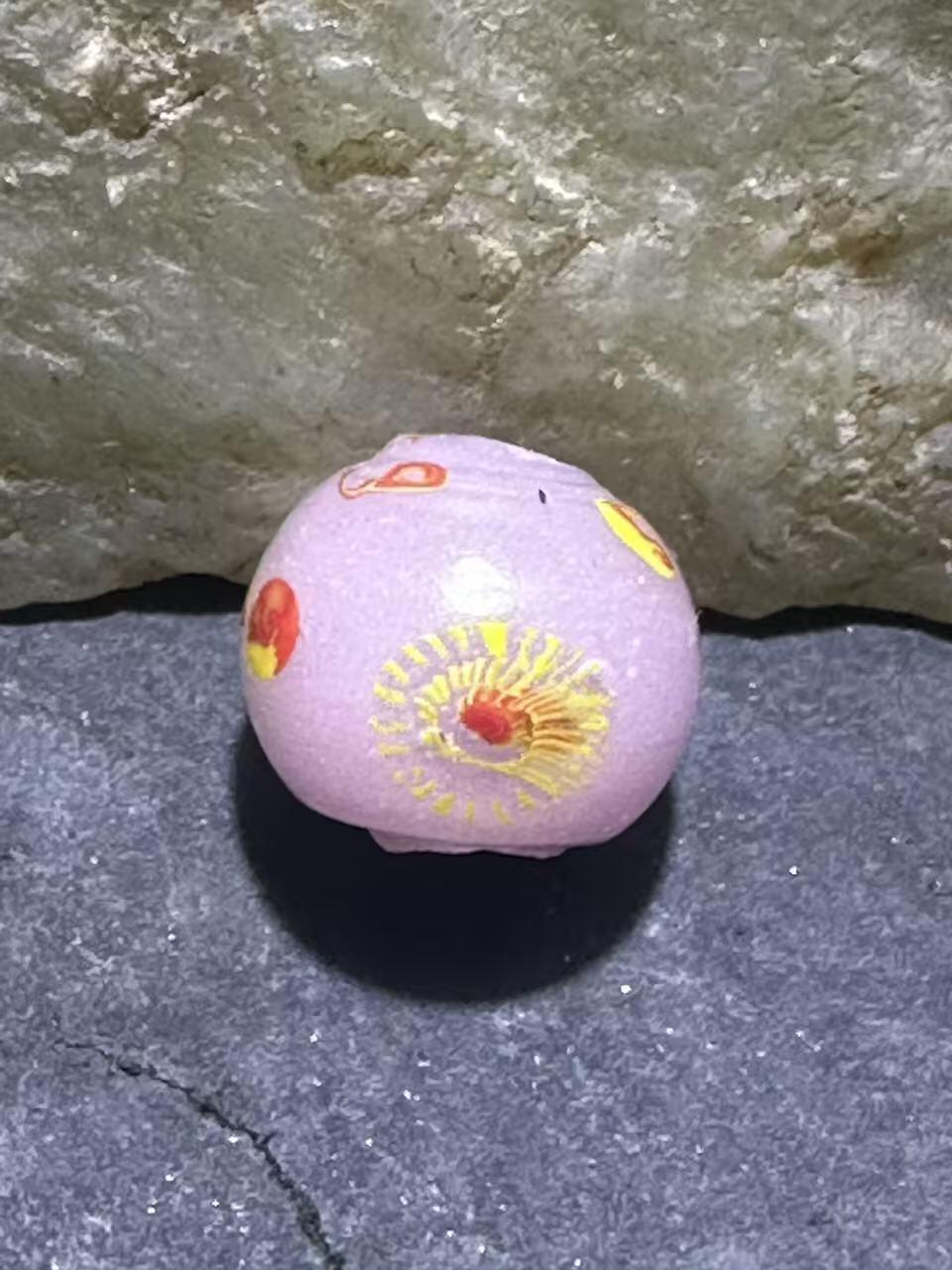 建国前后库存冰粉色祥云立体凤眼琉璃珠一颗，