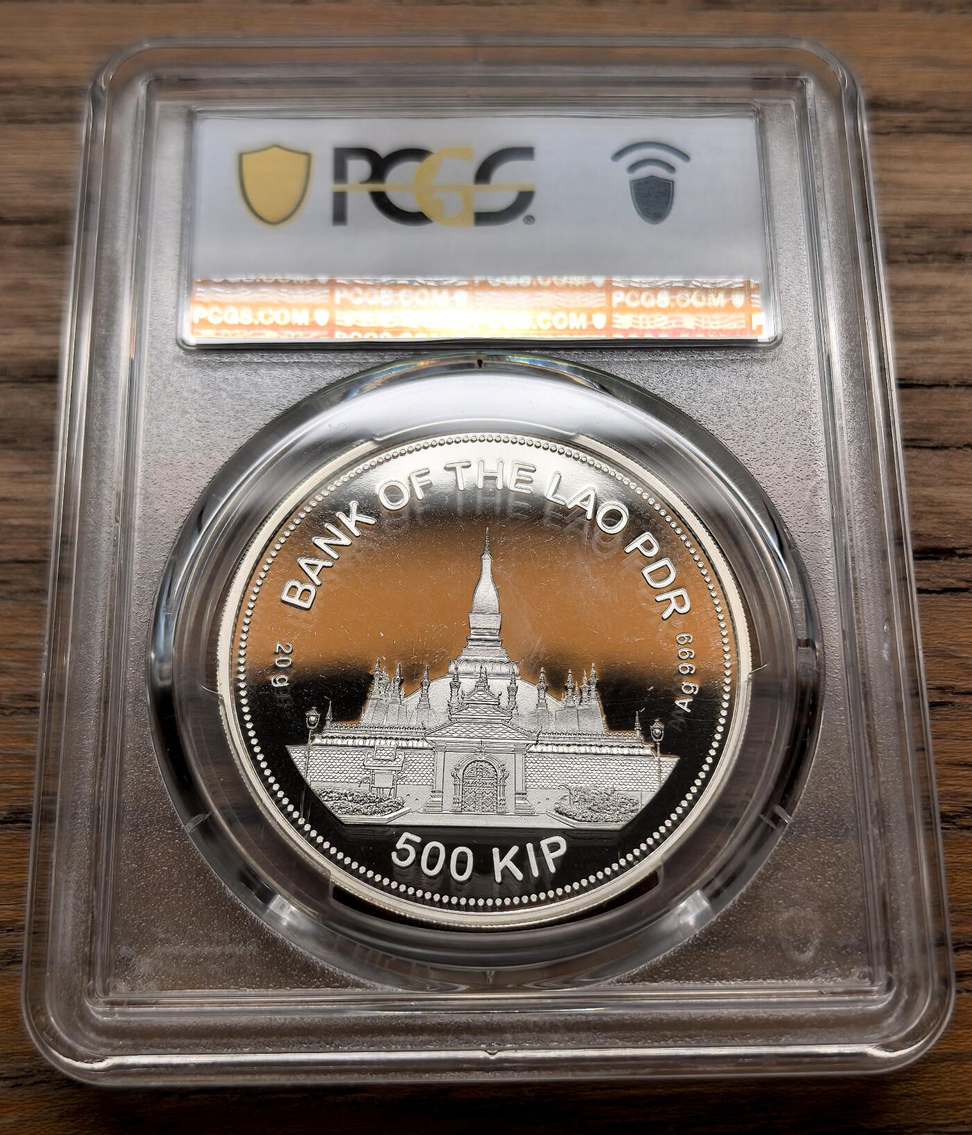 凡希社世界钱币微拍第三百十八期 2022老挝农历虎年500基普大银精铸PCGS-PF69DCAM，正面为孟加拉虎头部浮雕，背面主图案是老挝佛教圣地塔銮，铸造工艺精湛，发行量不多。