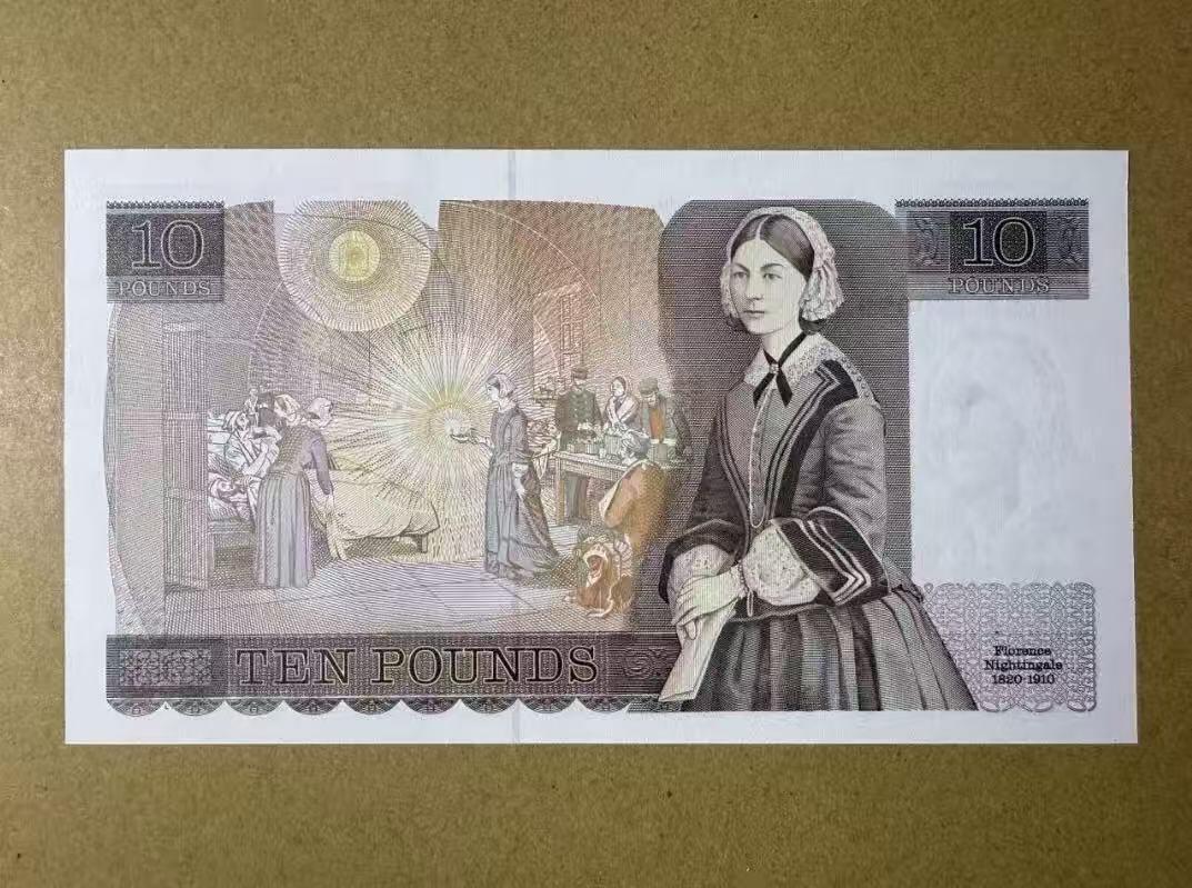 【礼羽收藏】🌏世界钱币拍卖第119期 英国D序列 1988-91年10镑 UNC 青年女王和南丁格尔 备注：正面中间上方有压痕。