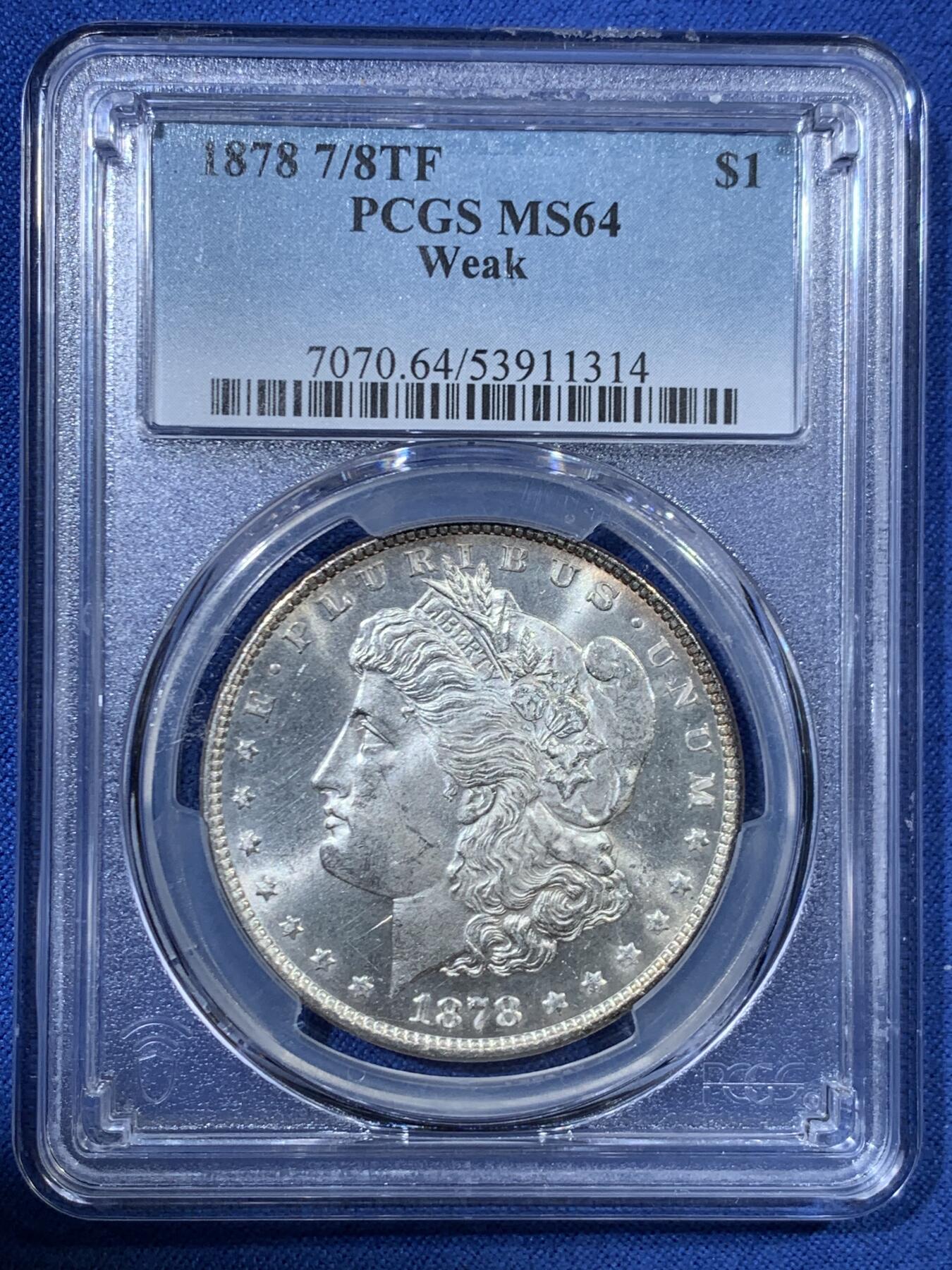 《竞宝斋》第456场 周日，周一，周二   3场连拍 （全场包邮）欢迎送拍 PCGS MS64 美国 1878 首年摩根 7/8 尾部羽毛复打 稀有版别 麦稀奇所见最高分 此枚霜感十足 打制深俊 发丝清晰