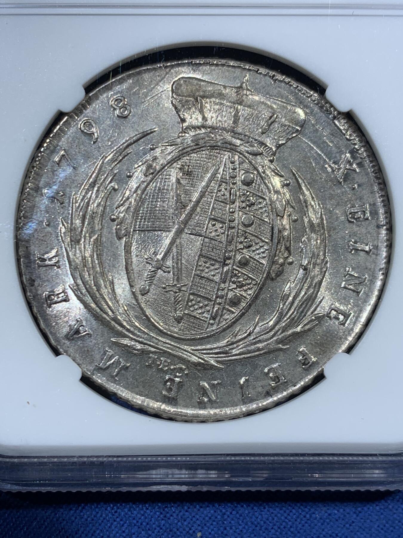 《竞宝斋》第456场 周日，周一，周二   3场连拍 （全场包邮）欢迎送拍 NGCMS62+ 神圣罗马帝国时期1798年萨克森选侯国1泰勒银币，正面是作为帝国元帅的萨克森选帝侯胖特烈奥古斯特三世军装版，属于62分中状态最佳的，更高分仅3枚，原始光度保留的非常好，不可多得的好状态