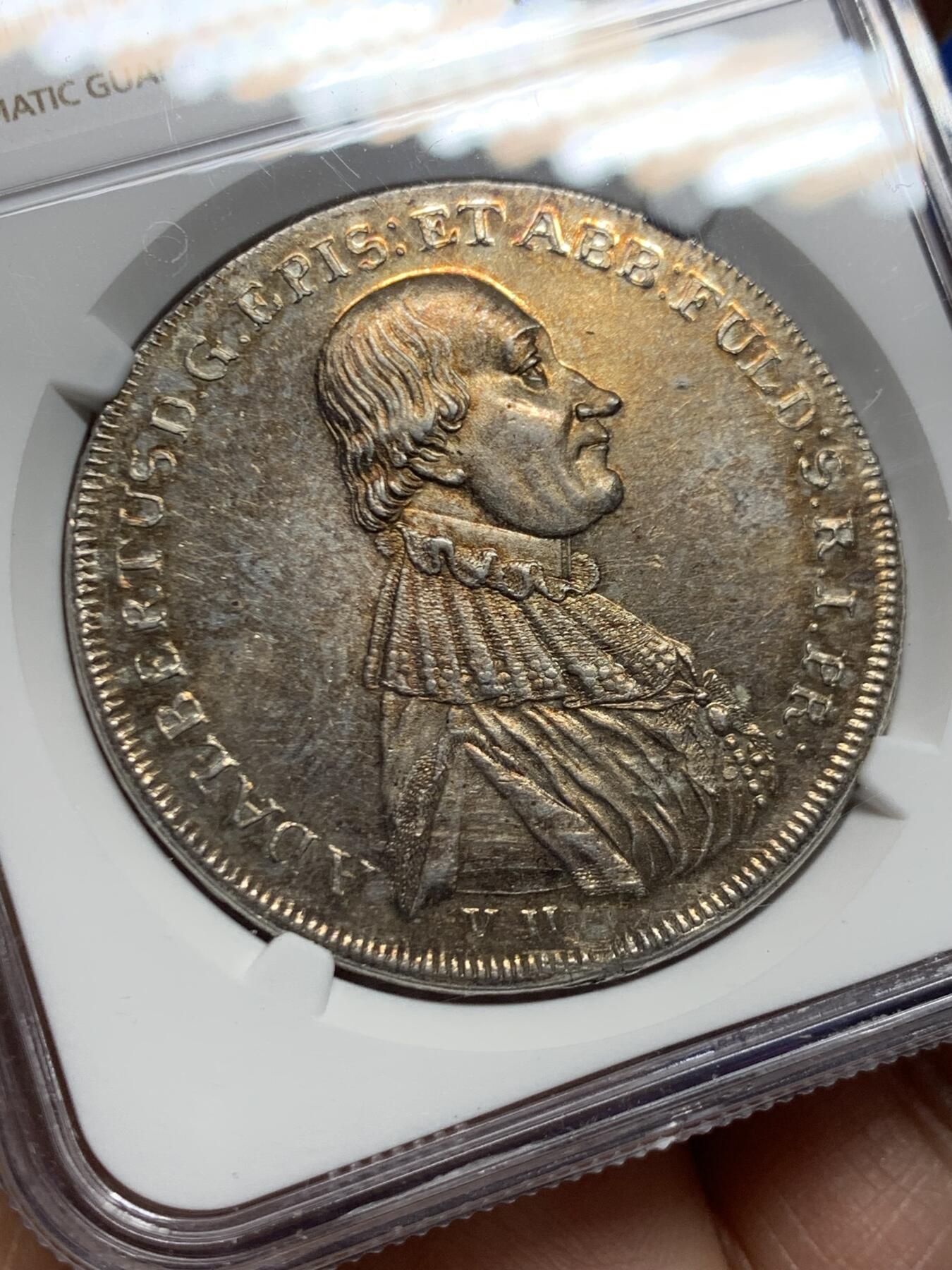 《竞宝斋》第457场 周日，周一，周二   3场连拍 （全场包邮）欢迎送拍 NGC MS61 神圣罗马帝国时期1796年富尔达1泰勒银币，位于黑森州富尔达天主数区自治领地，人像为大主教网达尔伯特冯·哈斯塔尔，底板状态和光度都不错，略有低评，也是神罗系列中值得收藏的品种之一