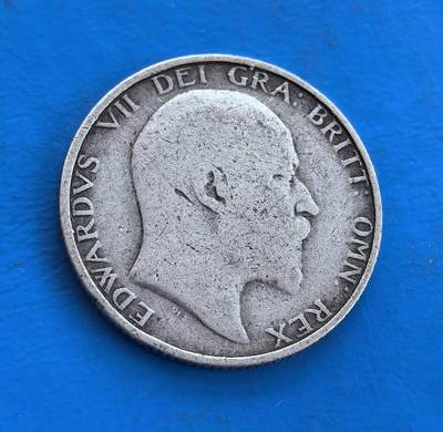 外国优质银币南亚香港苏联等专场，周六九点倒数截拍，满百包邮，持续收拍 - 英国1904 年爱德华七世 1 先令银币，正面是国王侧面像，轮廓虽经磨损仍显威严；背面为皇冠雄狮浮雕，承载大英帝国历史印记，百年银质包浆温润厚重，兼具流通币的实用价值与历史收藏意义。