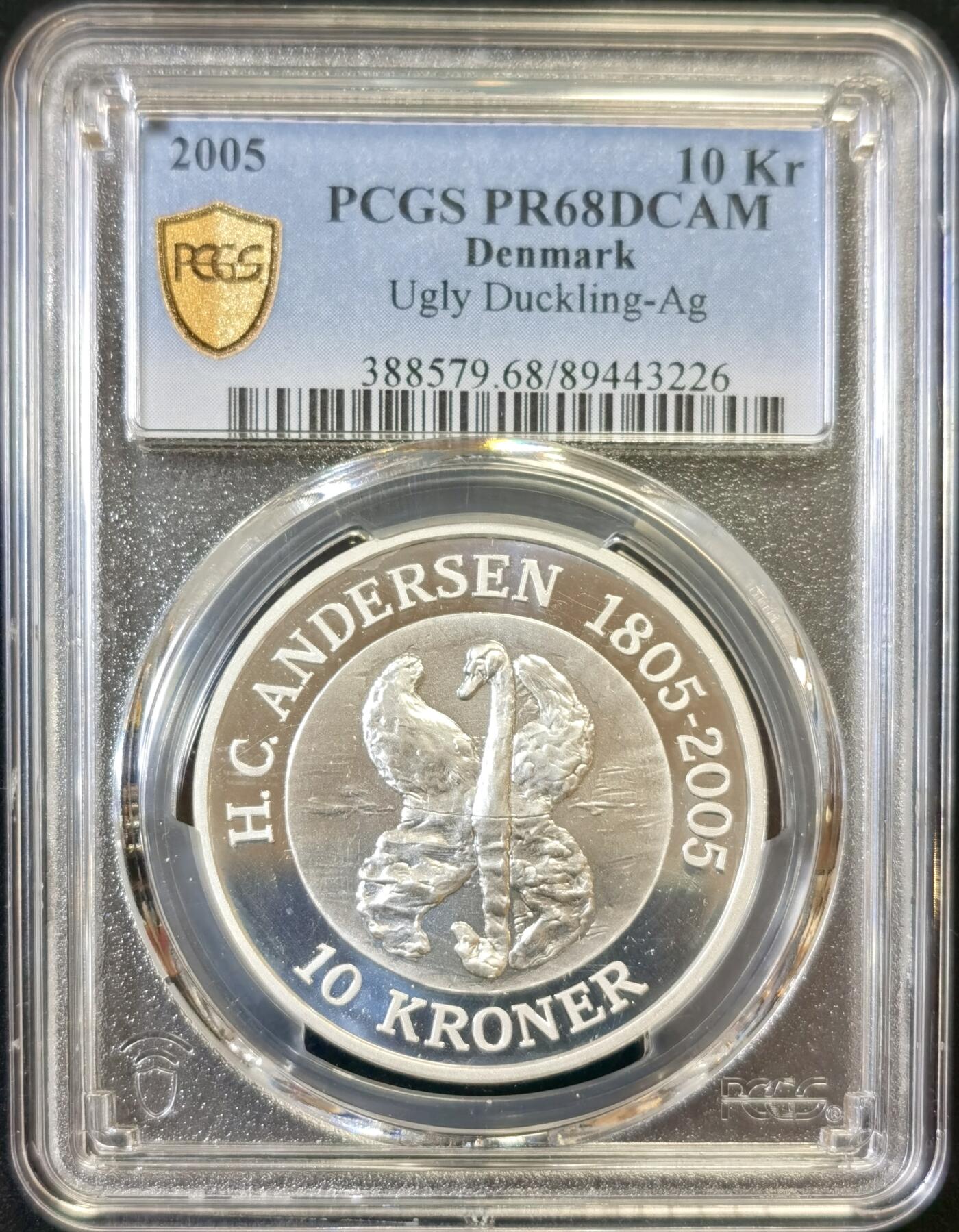 甄臻铺-世界币章拍卖（第48期）精品场拍品征集中，送拍享返佣金等优惠多多 PCGS-PR68DCAM 丹麦2005年10克朗安徒生诞生200周年系列丑小鸭（38毫米31.1克）精制纪念银币（更高分5枚）