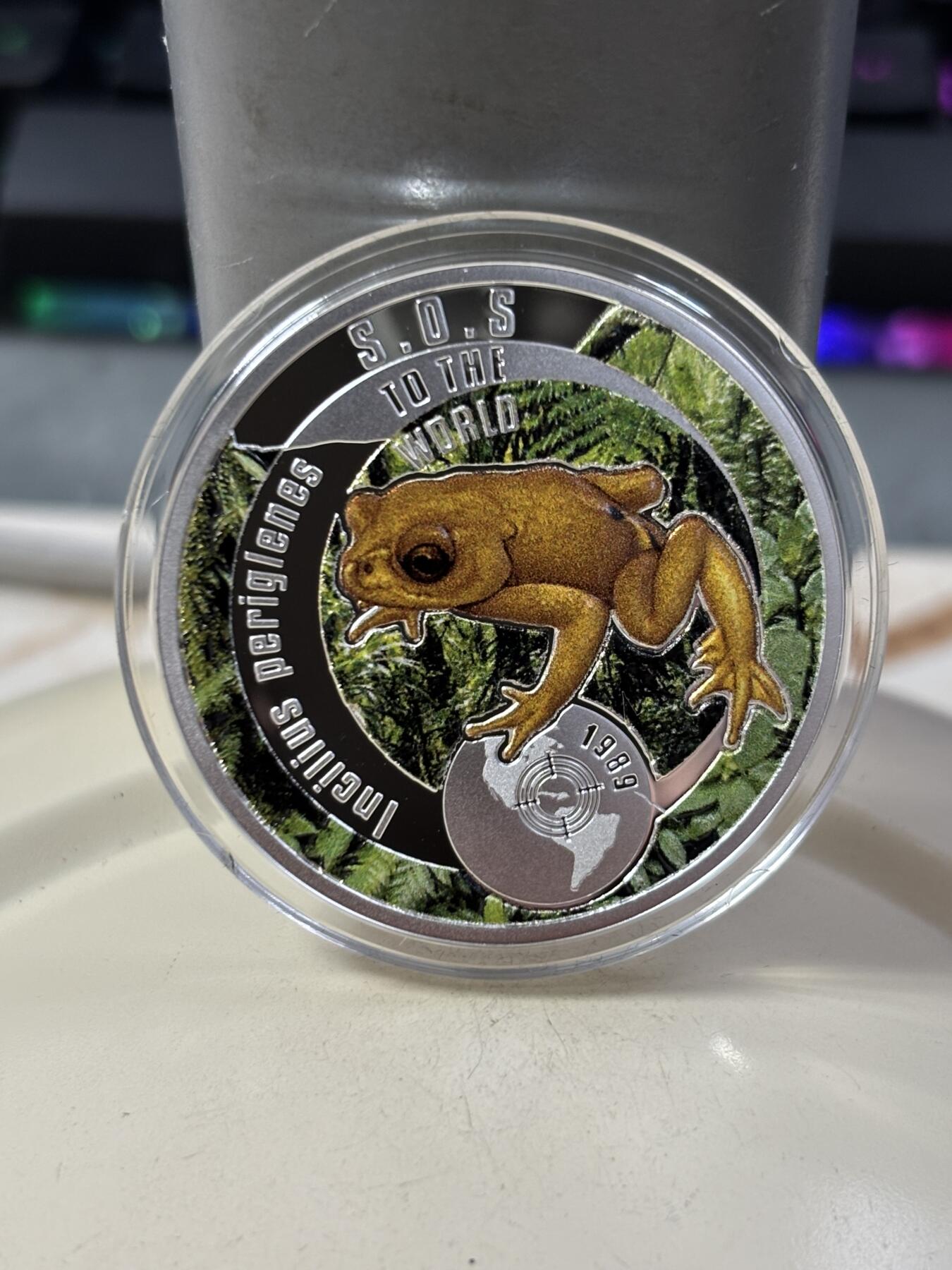 第188期拍卖 纽埃2016年拯救地球SOS系列2金蟾彩色精制银币，17.5克，发行999枚