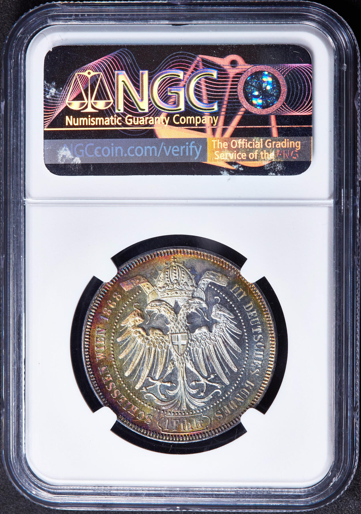 【俄甄集藏】“万象更新、马呈祥瑞”迎新春俄甄精品场-2026年(047)01-21 星期三 晚 19:30 全场包邮 奥匈帝国1868年纪念维也纳德意志地区第三届联邦射击节奥地利女神与橡树1泰勒银币，NGC MS62，五彩酱彩养眼老包浆，底板凝霜感强烈，难得的状态，疑似低评