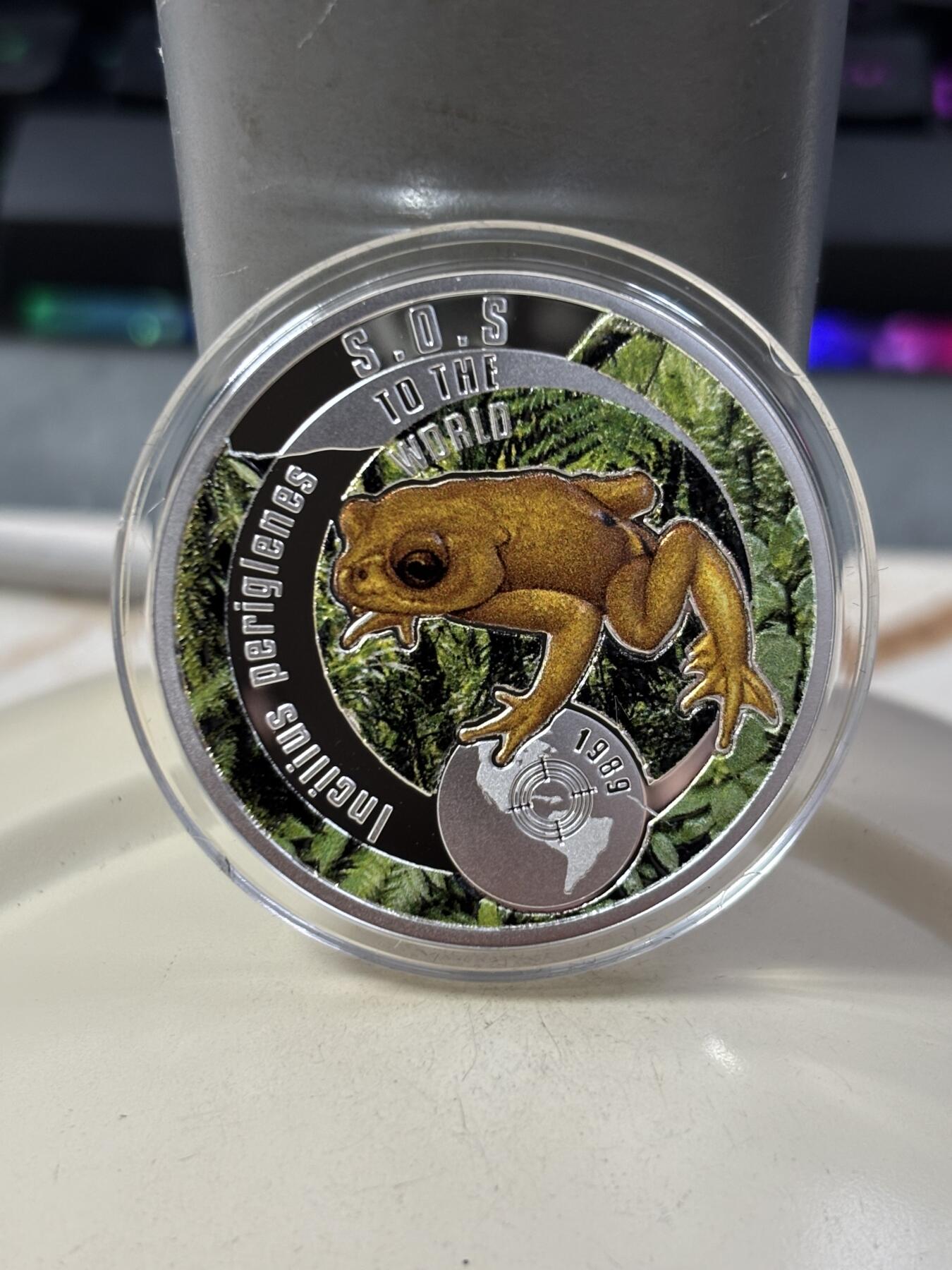 第188期拍卖 纽埃2016年拯救地球SOS系列2金蟾彩色精制银币，17.5克，发行999枚