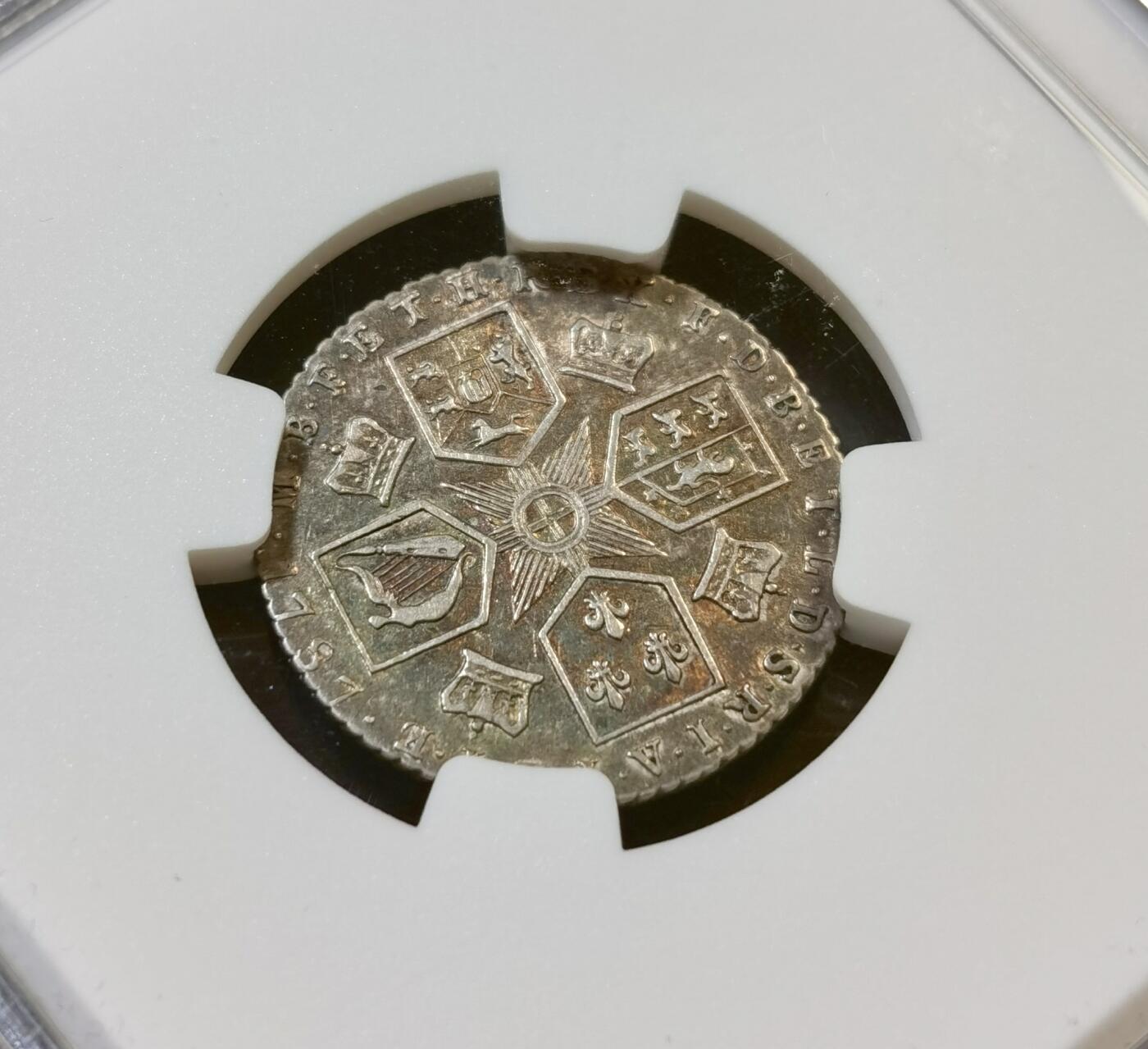 甄臻铺-世界币章拍卖（第48期）精品场拍品征集中，送拍享返佣金等优惠多多 NGC-AU55 1787年英国乔治三世六便士银币，正面刻有乔治三世头像，背面是六边形纹章图案和十字星装饰