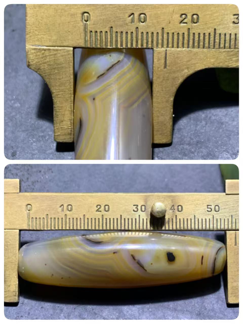 巴西玛瑙千层纹随形桶珠一个，