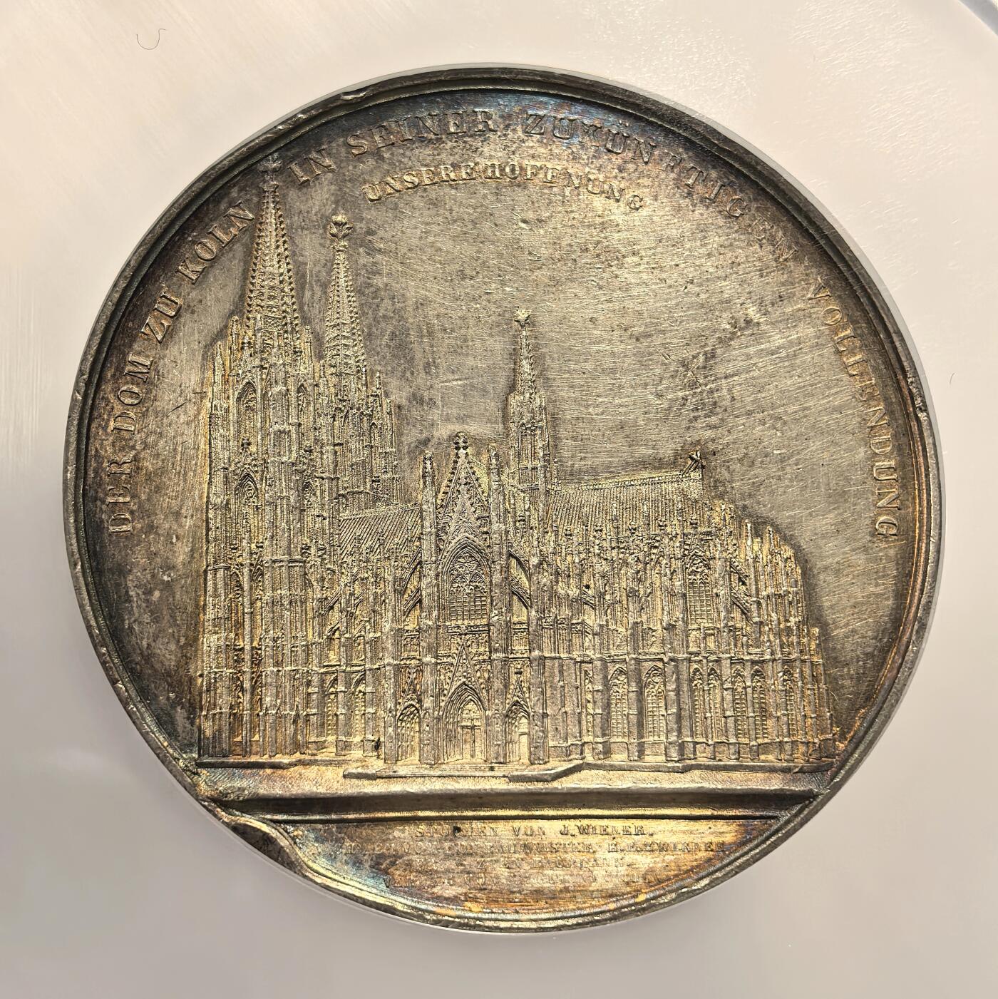 博洋堂世界钱币拍卖第157期（全场包邮） NGC UNC 德国1851年克隆大教堂纪念银章，J.Wiener代表作大教堂系列之一，直径59mm。科隆大教堂建于1248-1880年，耗时超过600年，二战时经历空袭，有14处严重受损创面，反面内容是十九世纪维修的场景。