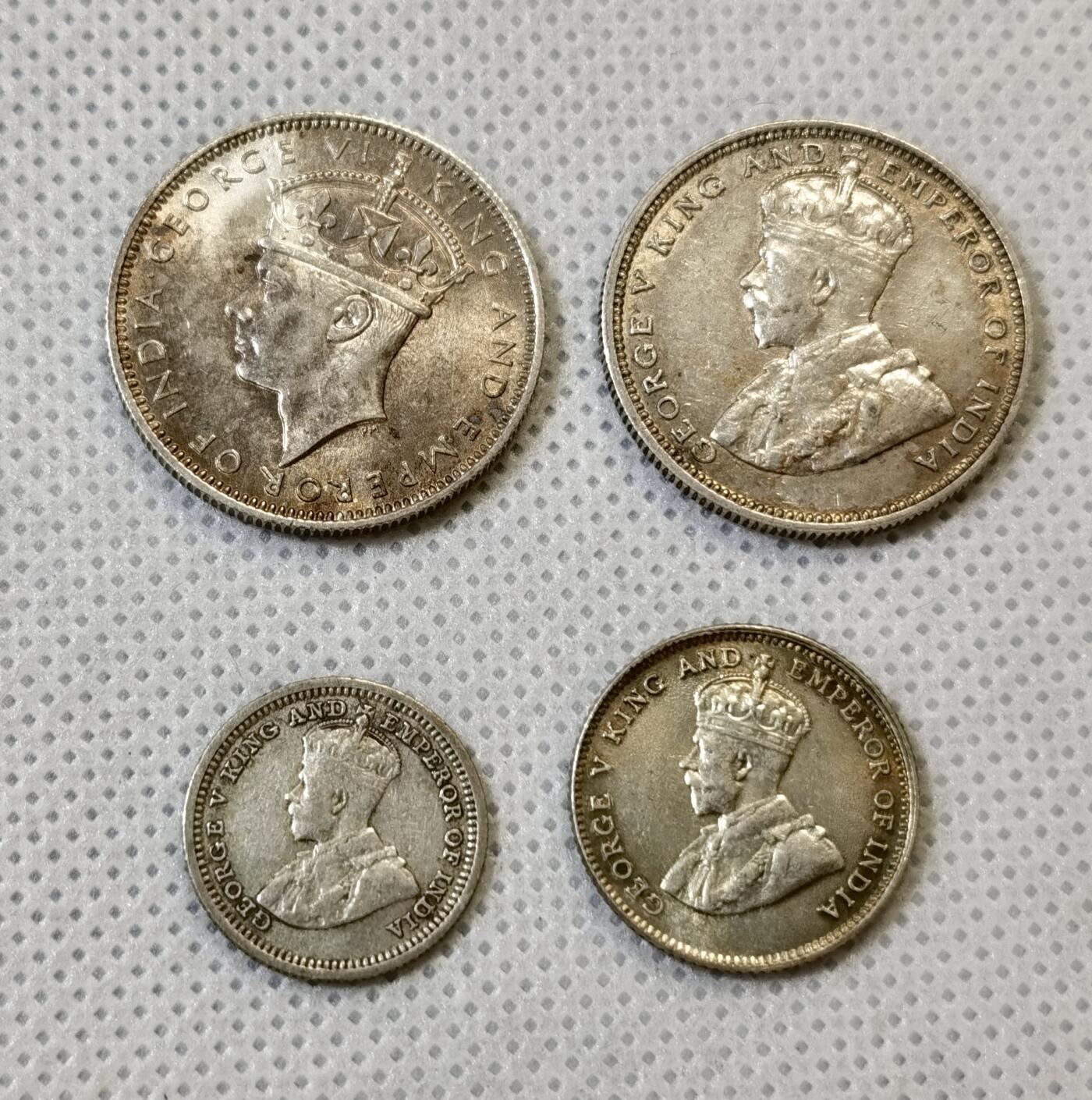 甄臻铺-世界币章拍卖（第48期）精品场拍品征集中，送拍享返佣金等优惠多多 四枚一组，乔五海峡银币五分、十分、20分，unc状态；乔六海峡20分，63-64状态