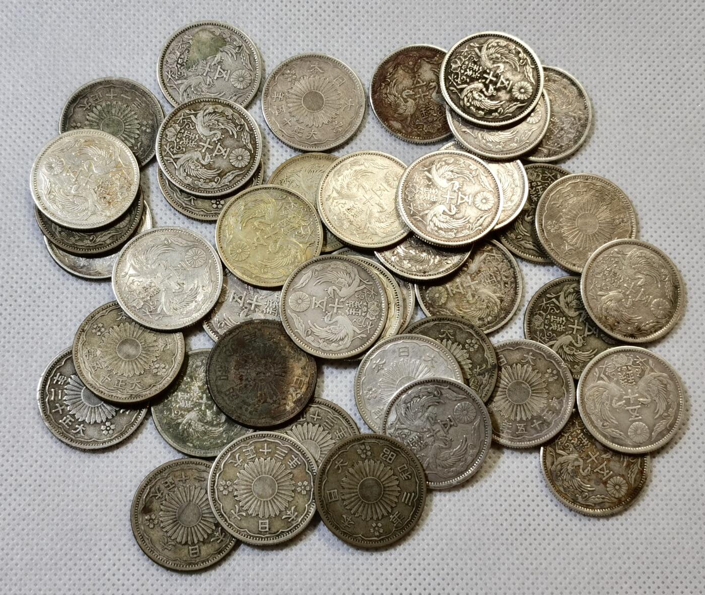 甄臻铺-世界币章拍卖（第48期）精品场拍品征集中，送拍享返佣金等优惠多多 日本 双凤五十钱银币 42枚一组，品相如图