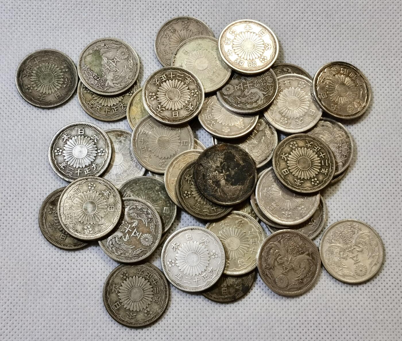 甄臻铺-世界币章拍卖（第48期）精品场拍品征集中，送拍享返佣金等优惠多多 日本 双凤五十钱银币 42枚一组，品相如图