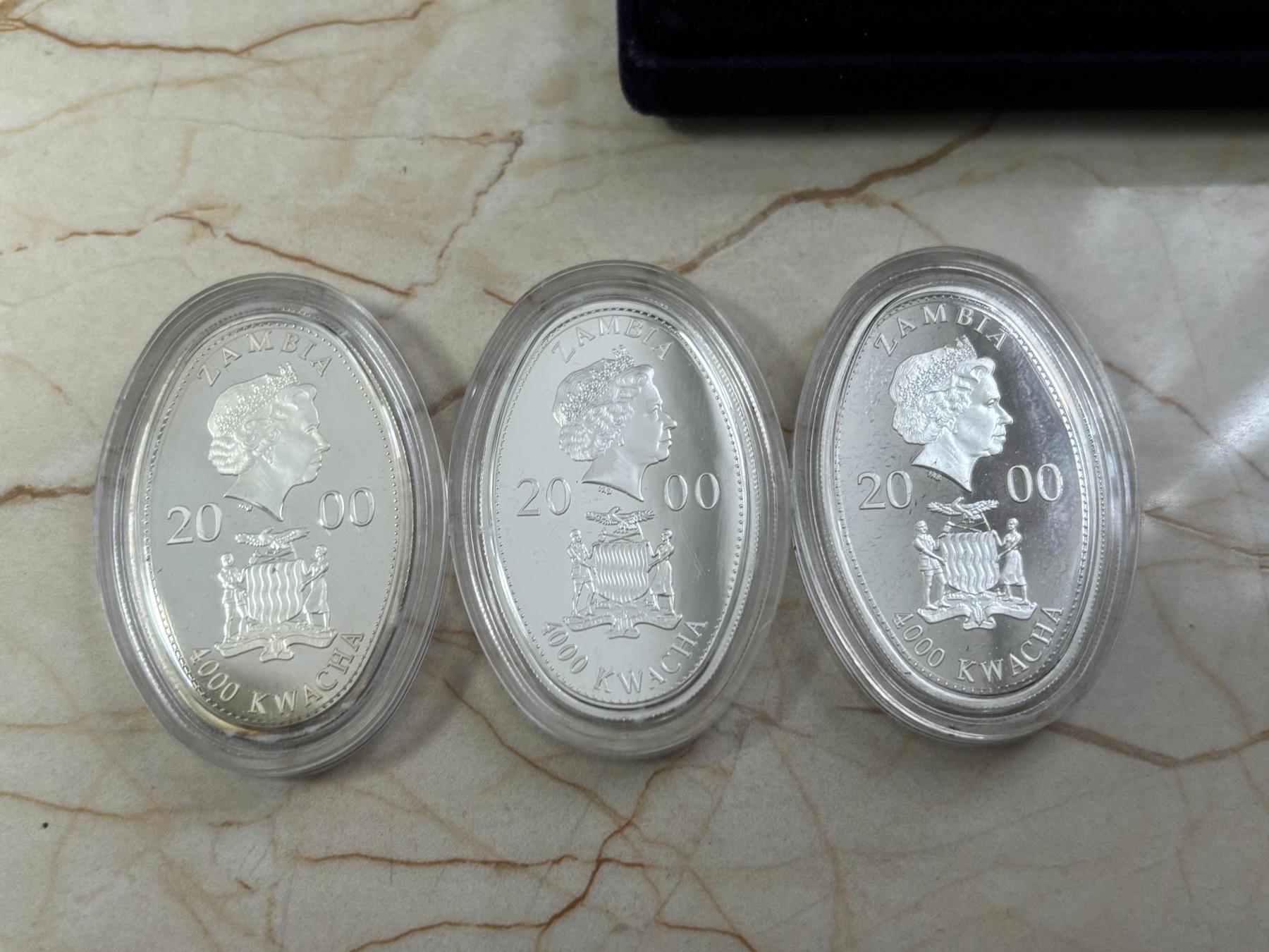 第188期拍卖 赞比亚2000年人类航海千年2椭圆形彩色精制纪念银币3枚套，20克*3,925银，发行15000套，有氧化