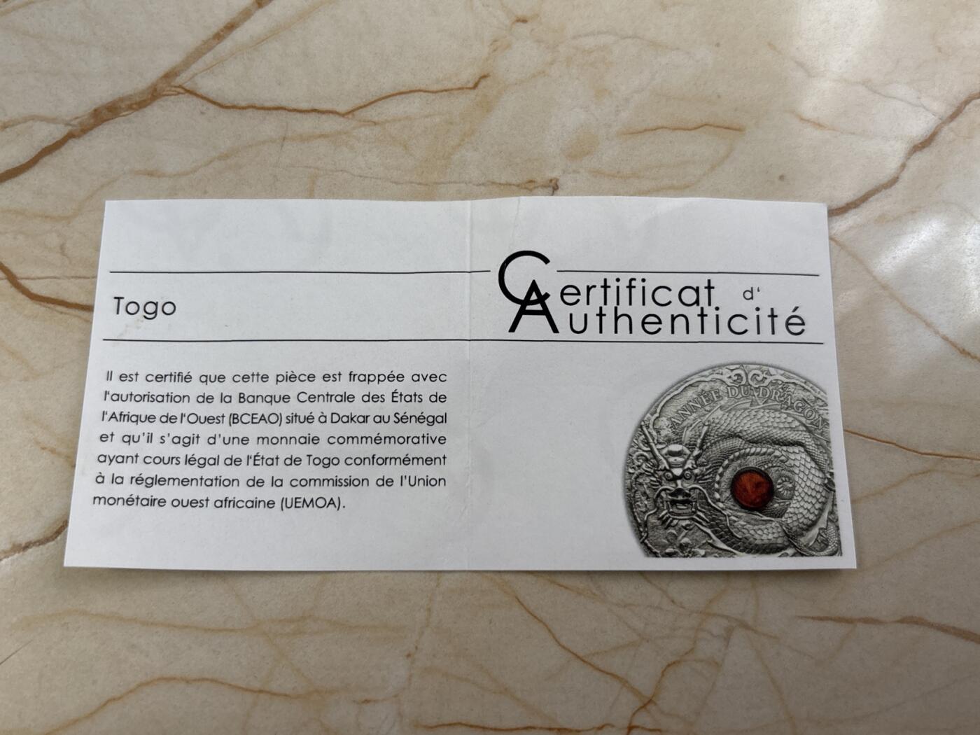 第188期拍卖 多哥2012年中国生肖龙年2盎司镶嵌琥珀仿古银币，999银，发行999枚