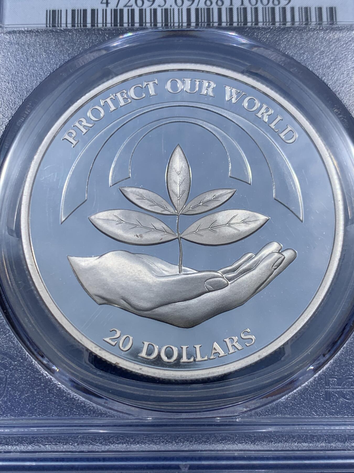 《竞宝斋》第459场 周日，周一，2场连拍 （全场包邮）欢迎送拍 PCGS PR69DC 纽埃1993年保护地球20元精制大银币，捧着树苗的手寓意着生命和希望，31.47g，925银