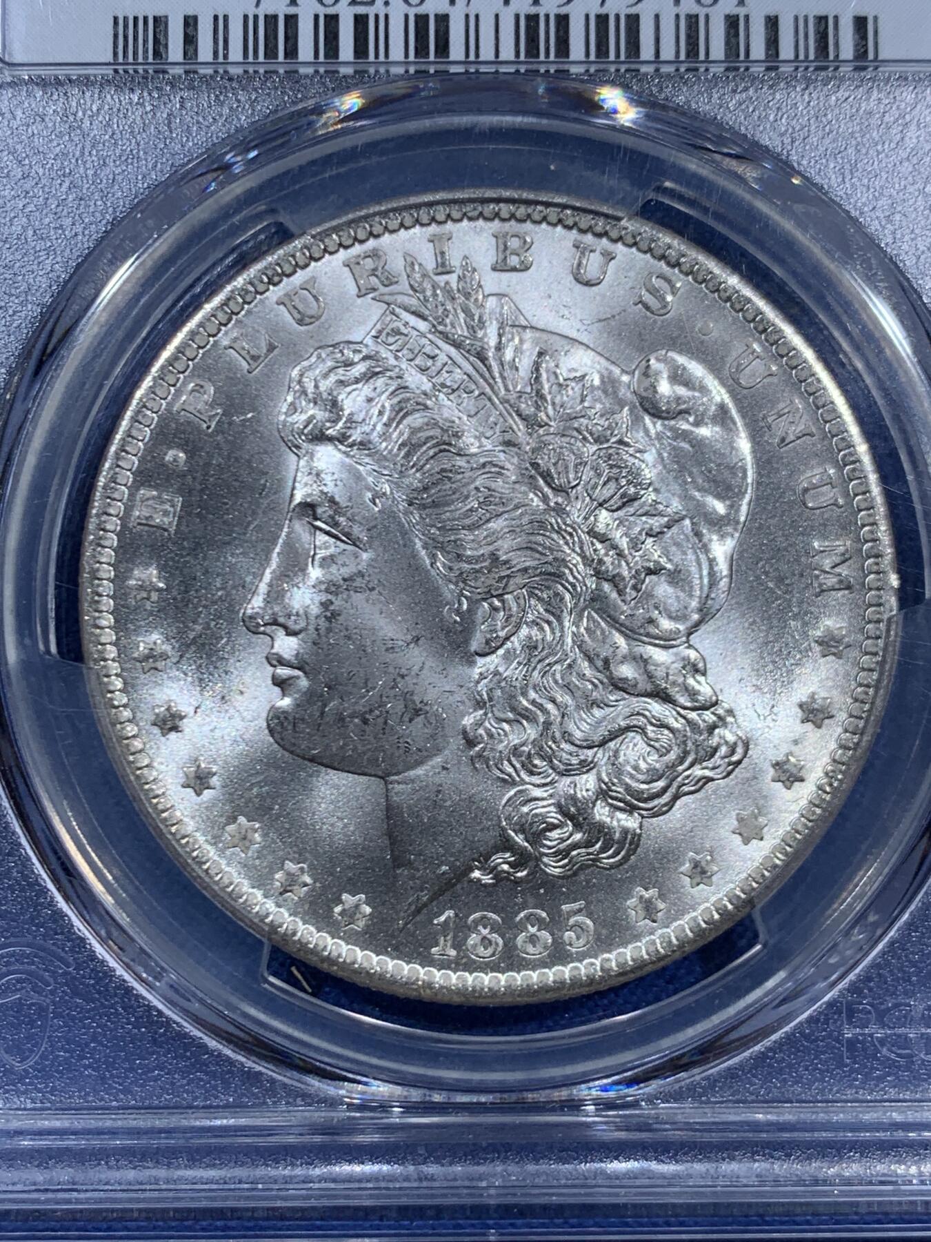 《竞宝斋》第460场 周日，周一，2场连拍 （全场包邮）欢迎送拍 PCGS MS64 美国1885-O版 摩根银币 背面支撑有磕