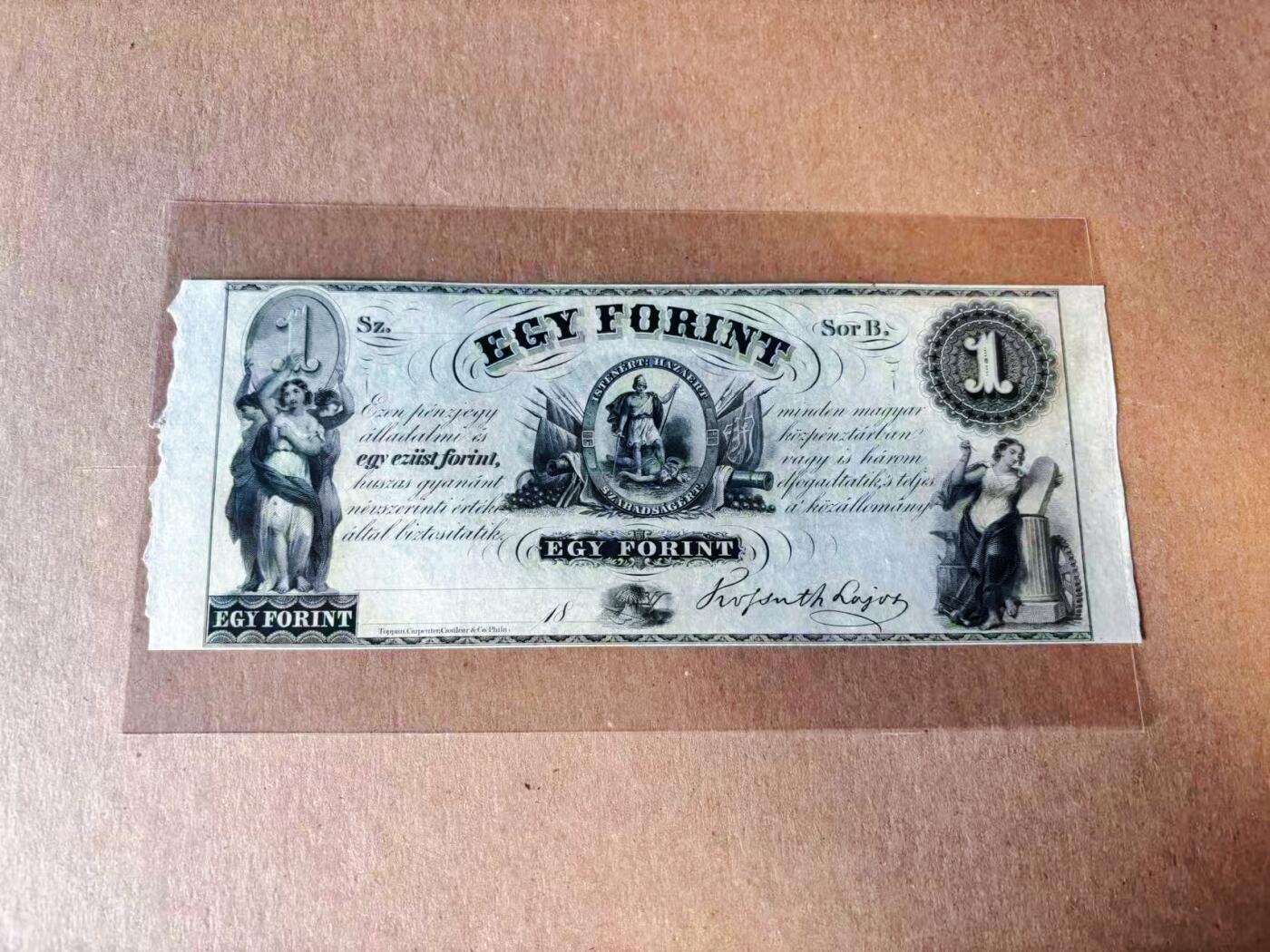 【Blue Auction】世界纸币精拍第777期——18级TOP拍卖/信誉/品质/专业/高效💫 匈牙利1852年1福林 主图为封建统治者被践踏 流亡政府募资用 恩格斯评价为真正的革命 美国代印 超大票幅 原汁原味 手签 UNC-