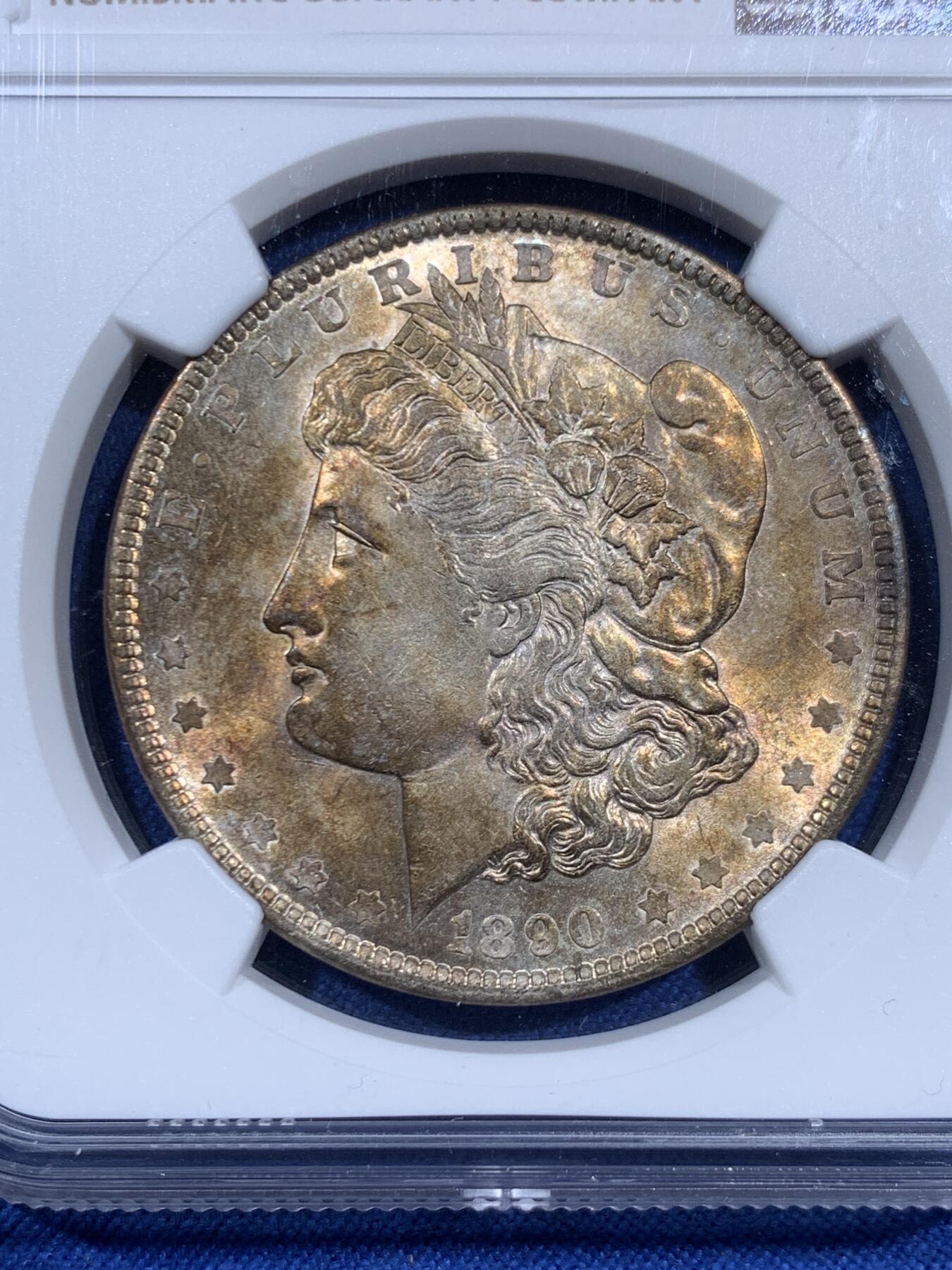 《竞宝斋》第460场 周日，周一，2场连拍 （全场包邮）欢迎送拍 NGC UNC 美国1890年摩根银币，淡金彩，略少见的年份。